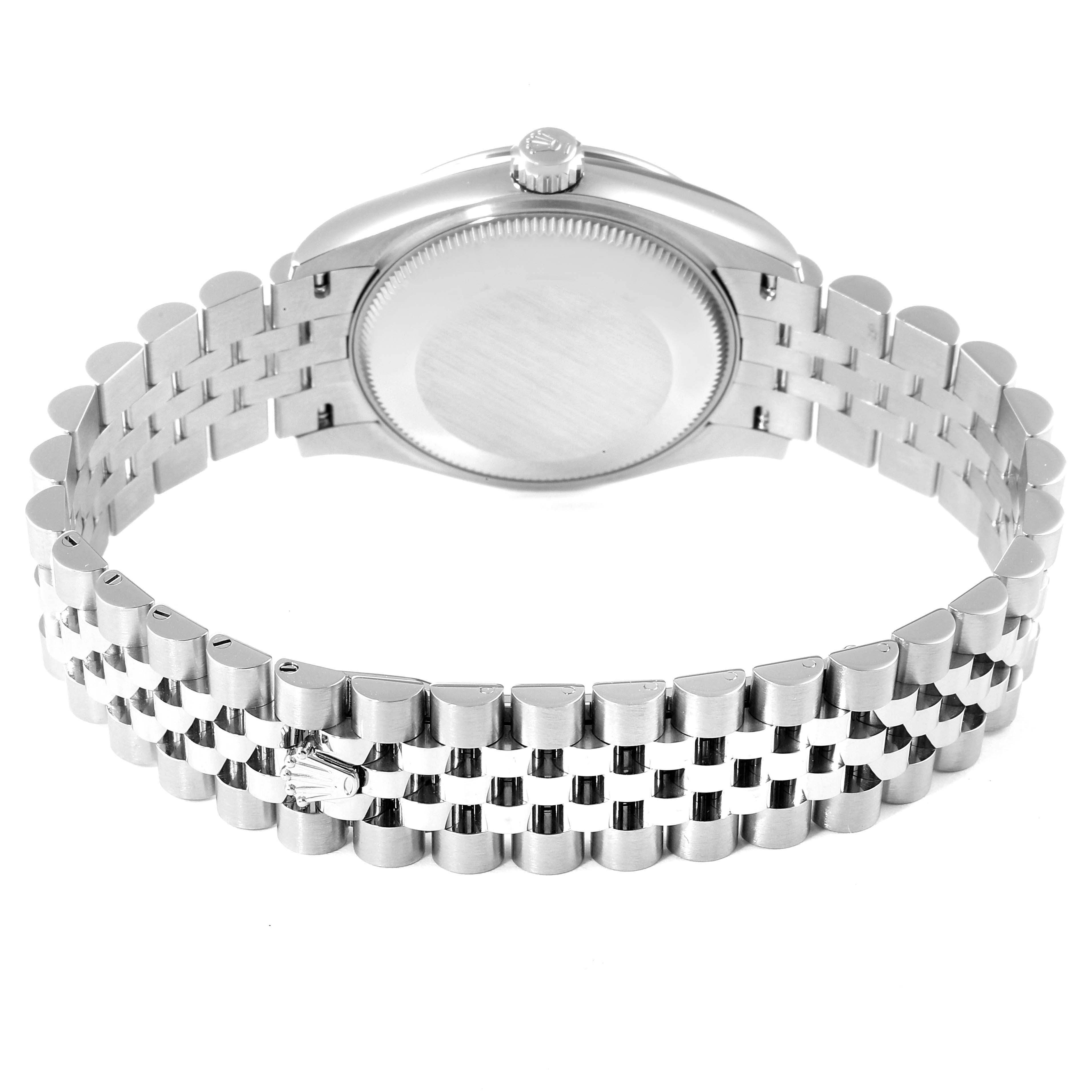 The image shows the back case and bracelet of a mid-size Rolex watch from a rear angle.