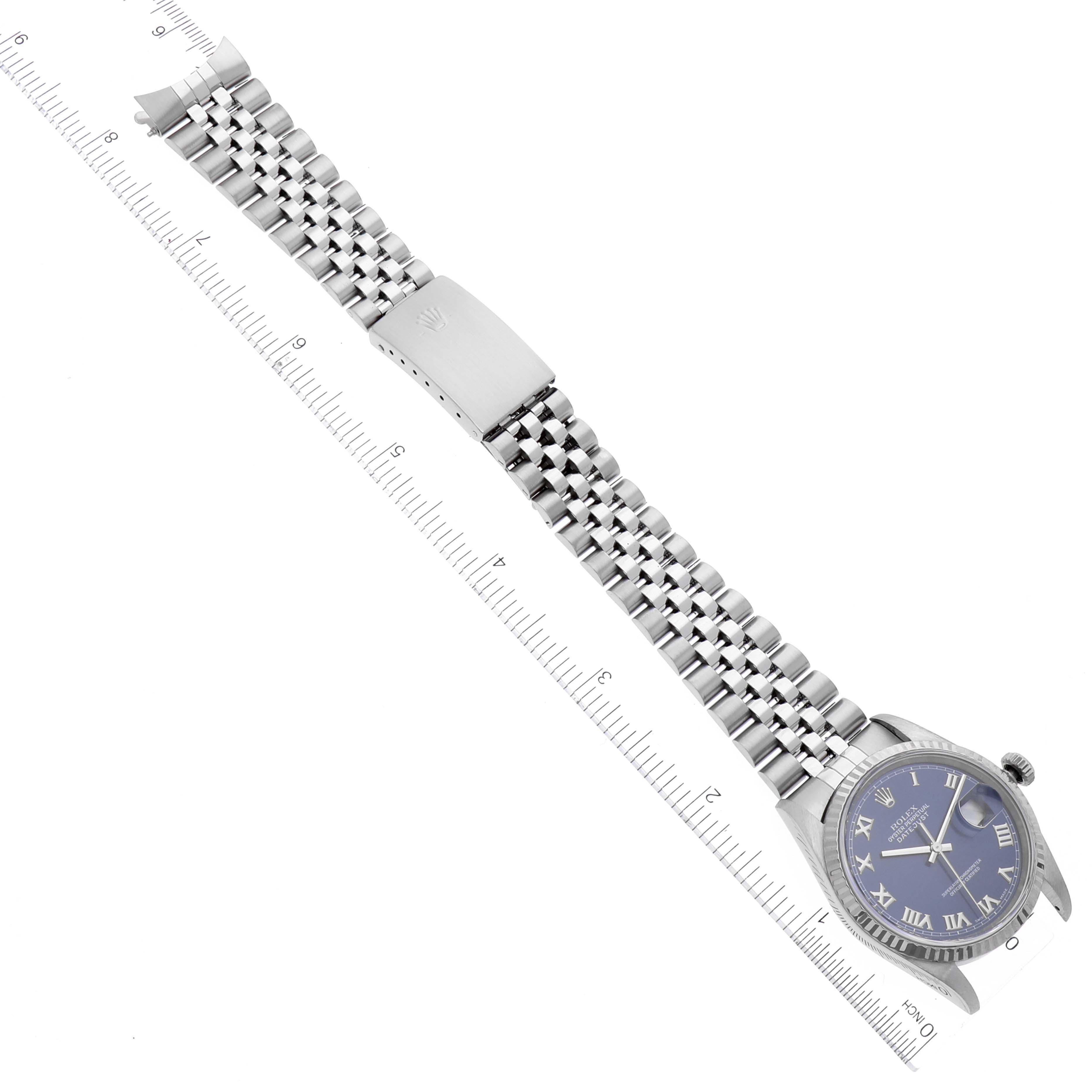 The Rolex Datejust 16234 Men's Stainless Steel Blue Dial 16234 Men's Stainless Steel Blue Dial watch is shown from a top-down angle, featuring the dial, bezel, and metal bracelet with a clasp.