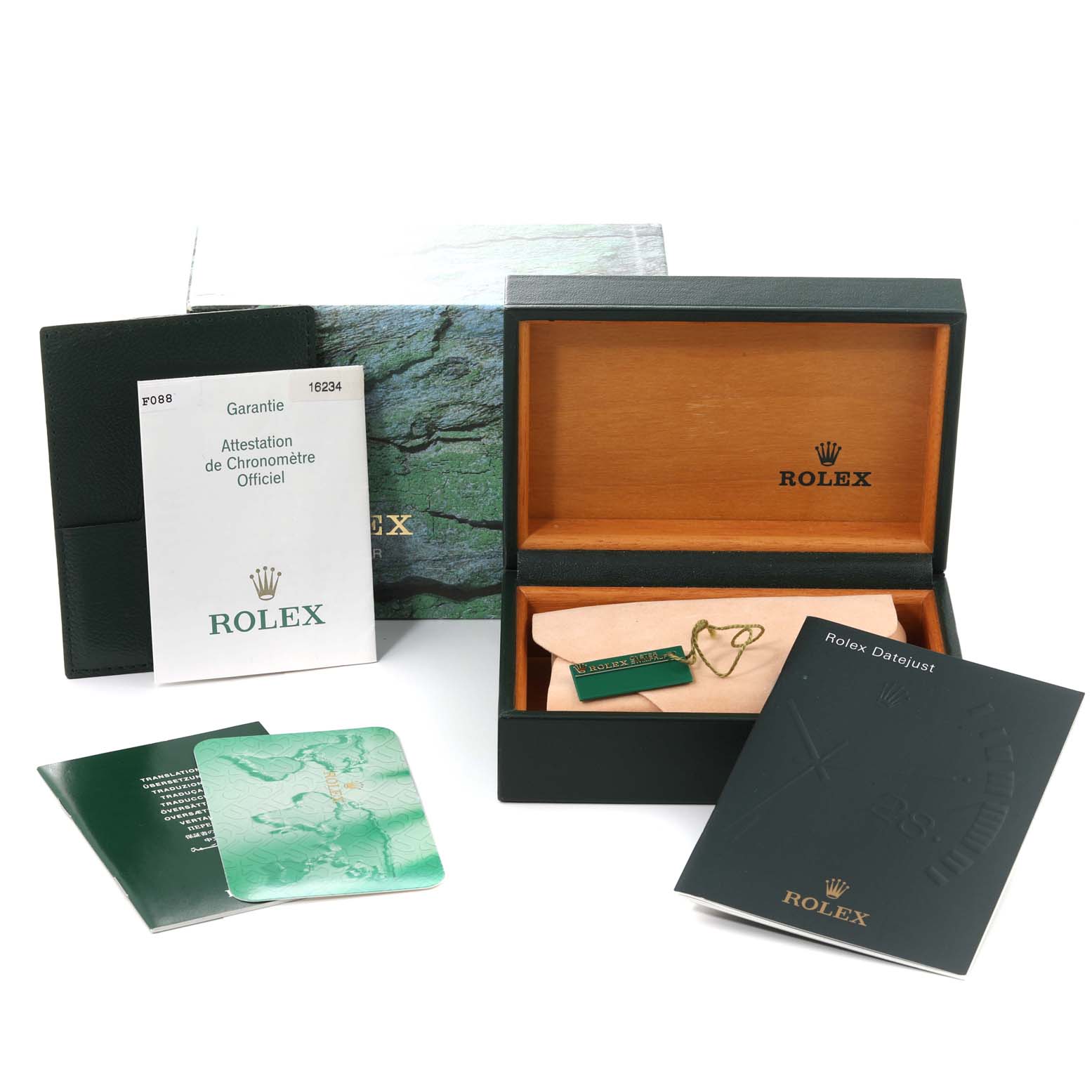 The image shows the Rolex Datejust 16234 Men's Stainless Steel Silver Dial 16234 Men's Stainless Steel Silver Dial box, warranty card, booklet, and accessories from a top view.