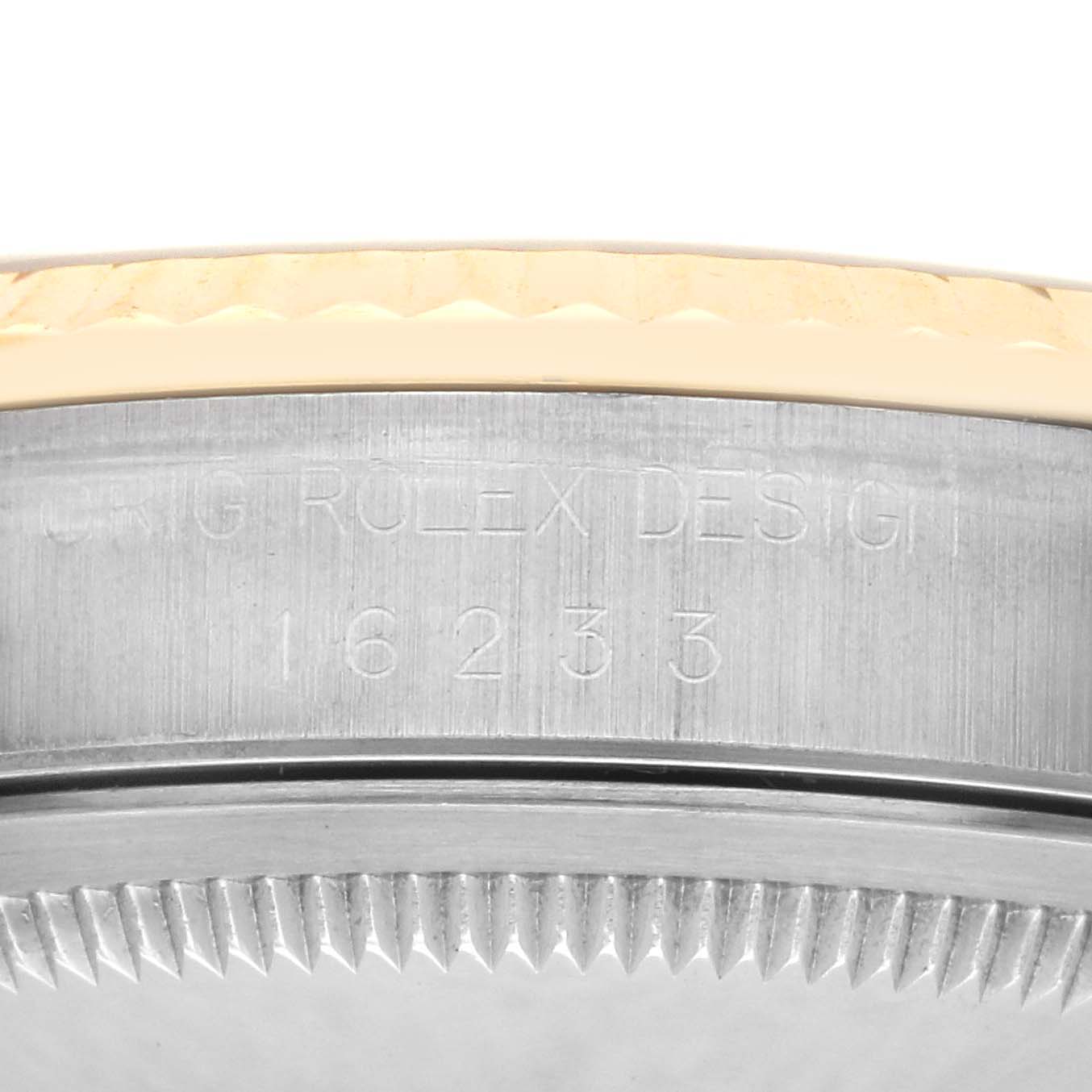 The image shows the side of the Rolex Datejust 16233 Men's Steel and Gold (two tone) Champagne Dial 16233 Men's Steel and Gold (two tone) Champagne Dial watch case with engraved numbers and part of the bezel.
