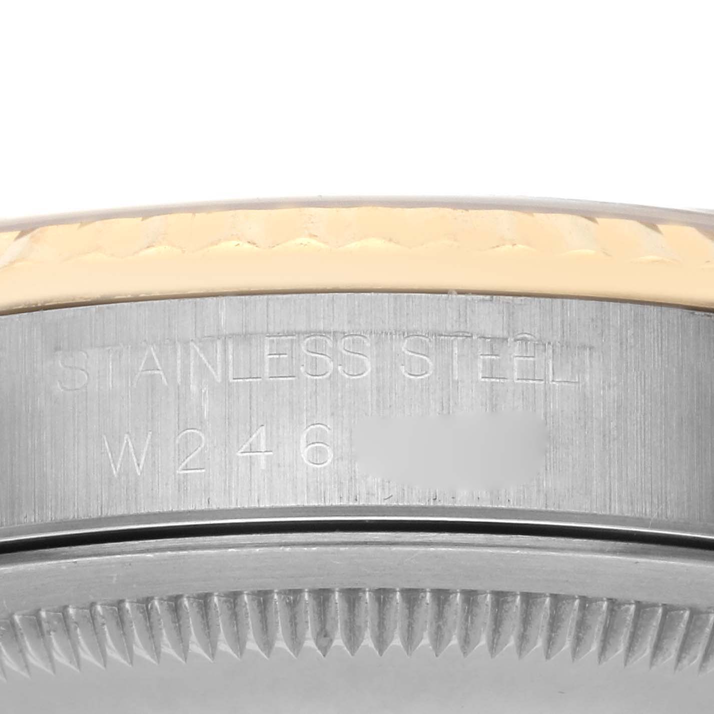 The image shows a close-up of the side of a Rolex Datejust 16233 Men's Steel and Gold (two tone) Champagne Dial 16233 Men's Steel and Gold (two tone) Champagne Dial watch, displaying the engraved "STAINLESS STEEL" text.