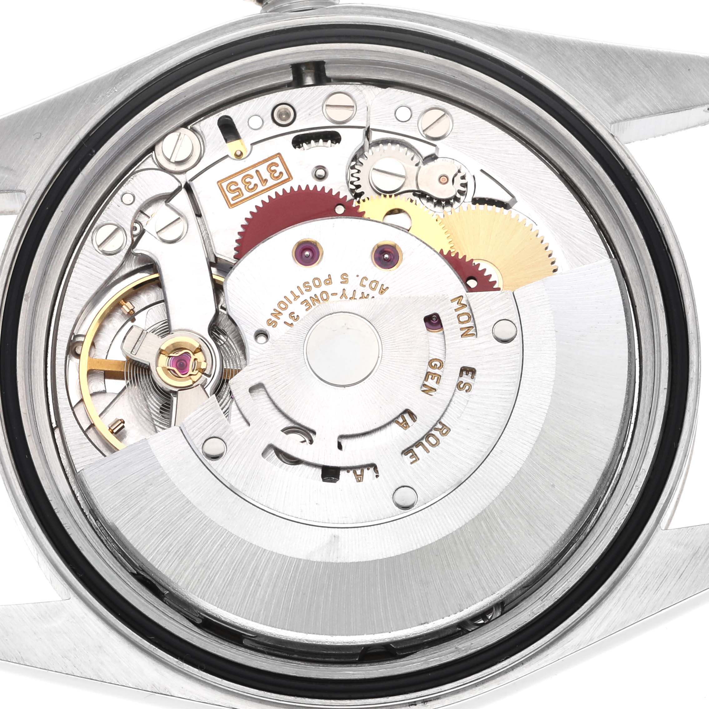 The image shows the internal mechanism of a Rolex Datejust 16233 Men's Steel and Gold (two tone) Champagne Dial 16233 Men's Steel and Gold (two tone) Champagne Dial, viewed from the back with gears and components visible.