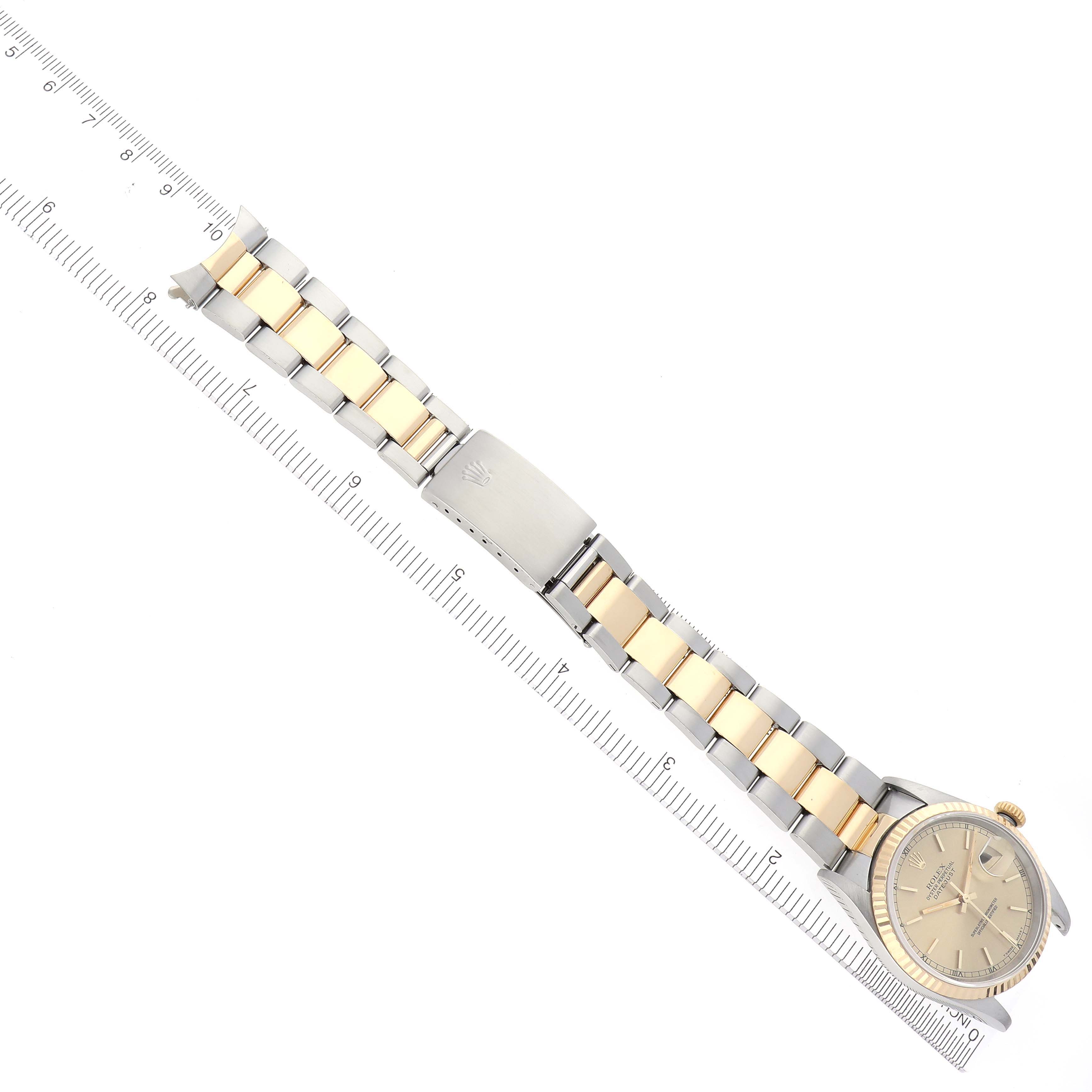 The Rolex Datejust 16233 Men's Steel and Gold (two tone) Champagne Dial 16233 Men's Steel and Gold (two tone) Champagne Dial watch is shown from a top view, displaying the full bracelet and the face at a slight angle.