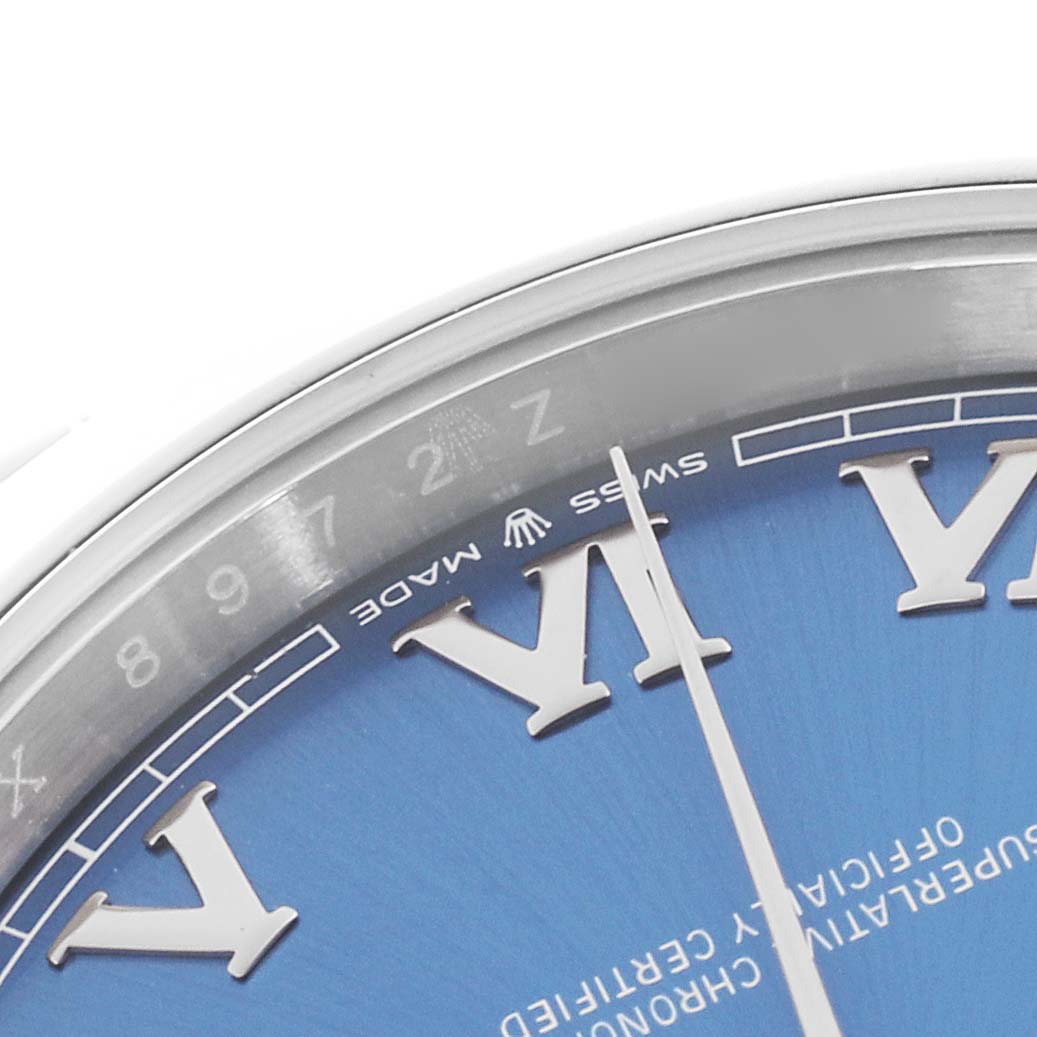 The image shows a close-up of the Rolex Datejust 41 126300 Men
s Stainless Steel Blue Dial 126300 Men
s Stainless Steel Blue Dial dial, highlighting Roman numerals and partial minute markings.