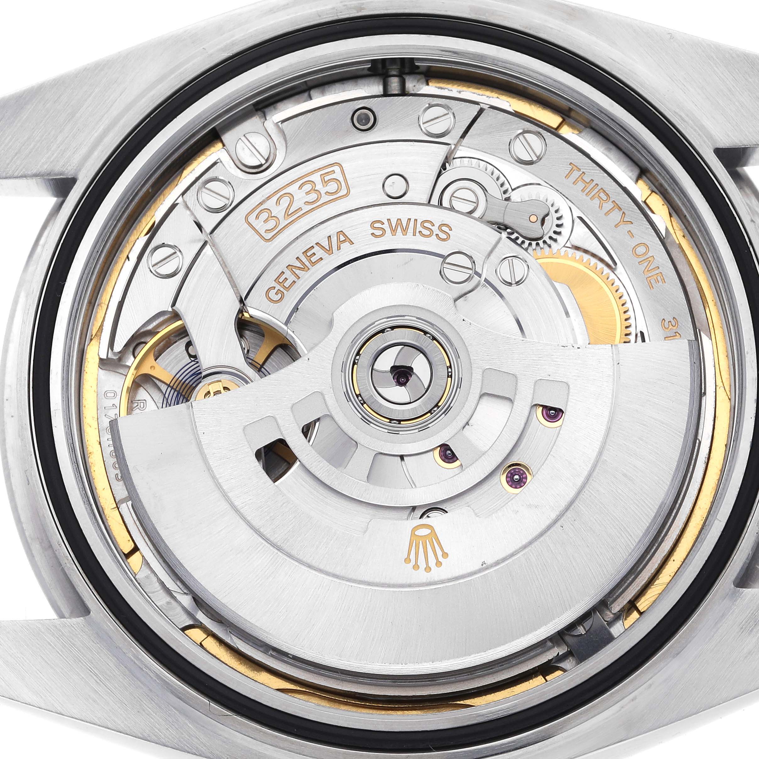 The image shows a close-up view of the Rolex Datejust 41 126300 Men
s Stainless Steel Blue Dial 126300 Men
s Stainless Steel Blue Dial
s movement, highlighting the intricate internal mechanism.