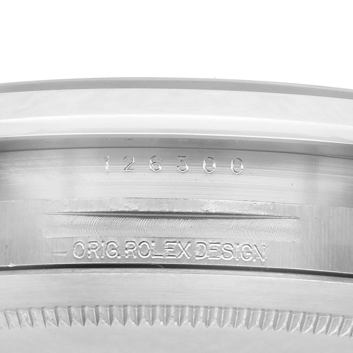 The image shows a close-up of the engraving on the case side of the Rolex Datejust 41 126300 Men
s Stainless Steel Blue Dial 126300 Men
s Stainless Steel Blue Dial, highlighting its model number and design.