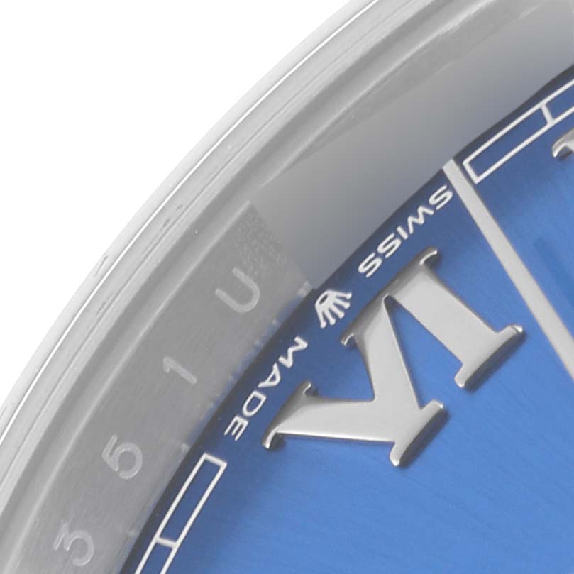 The image shows a close-up of the Rolex Datejust 41 126300 Men
s Stainless Steel Blue Dial 126300 Men
s Stainless Steel Blue Dial, focusing on the watch
s dial and part of the bezel.