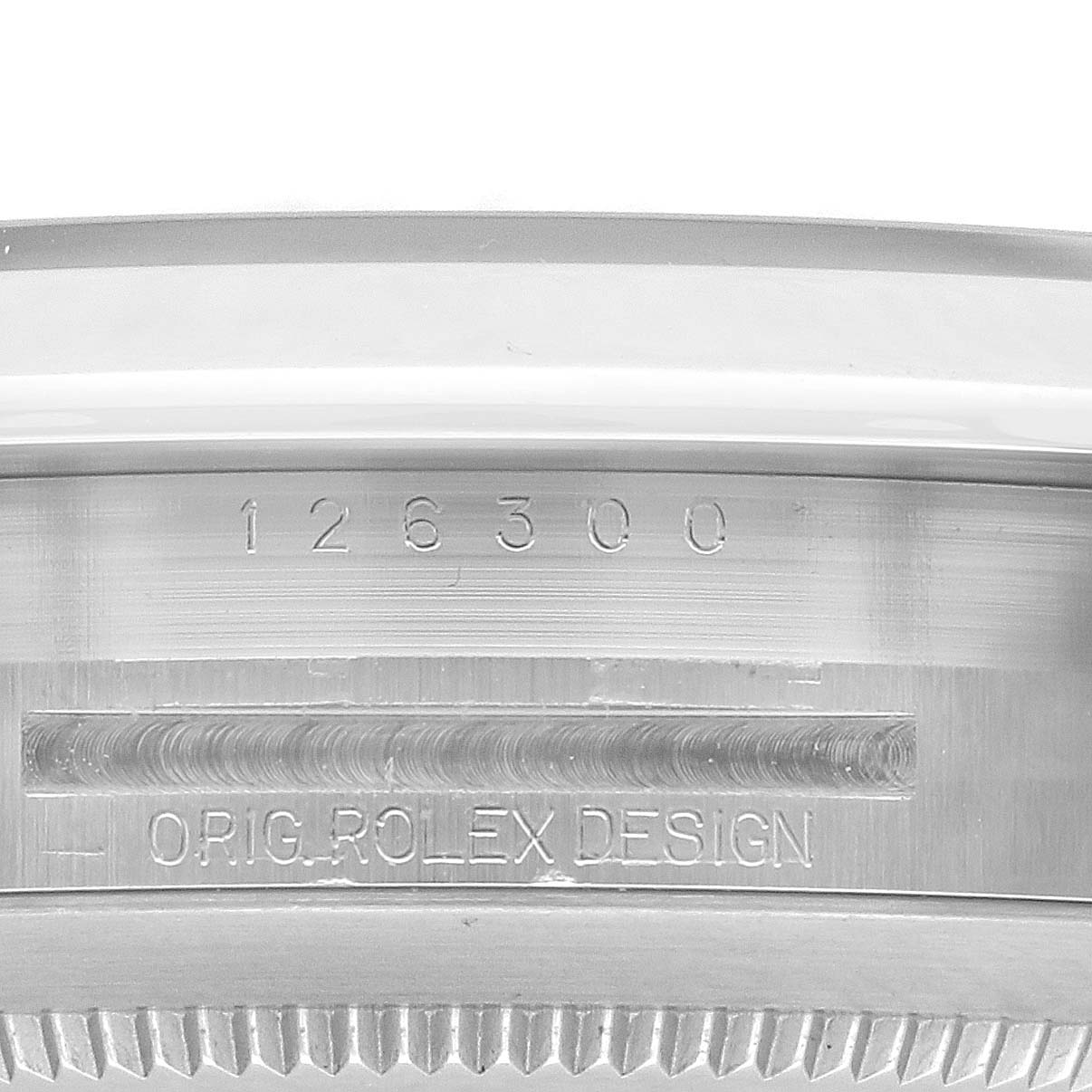 The image shows the model number and "ORIG. ROLEX DESIGN" engraving on the side of the Rolex Datejust 126300 Men
s Stainless Steel Grey Dial 126300 Men
s Stainless Steel Grey Dial 41 case.