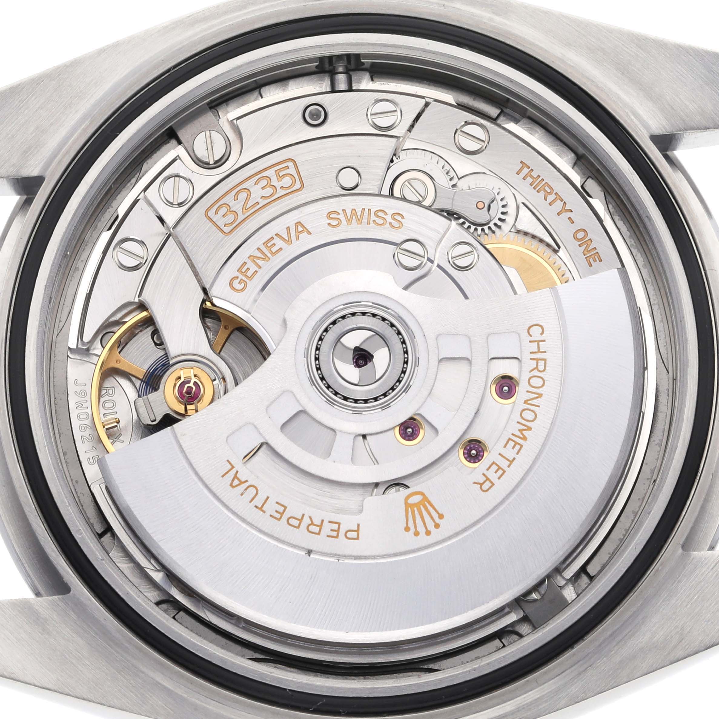 The image shows the movement of a Rolex Datejust 126300 Men
s Stainless Steel Grey Dial 126300 Men
s Stainless Steel Grey Dial 41 from the back, highlighting the rotor and gears.