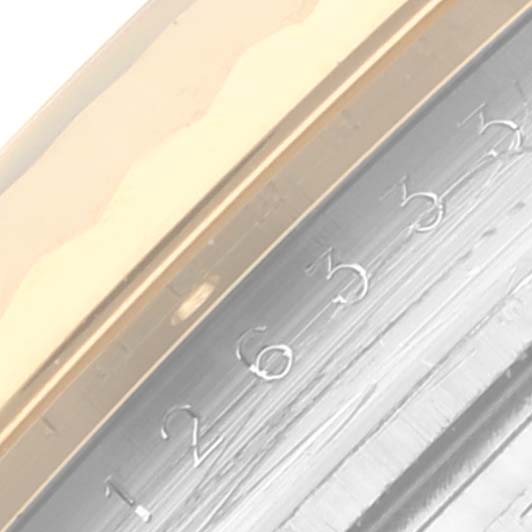 The image shows a close-up of the Rolex Datejust 41 126333 Men's Steel and Gold (two tone) Mother of Pearl Dial 126333 Men's Steel and Gold (two tone) Mother of Pearl Dial's bezel and edge of the case, highlighting the engraved numbers.