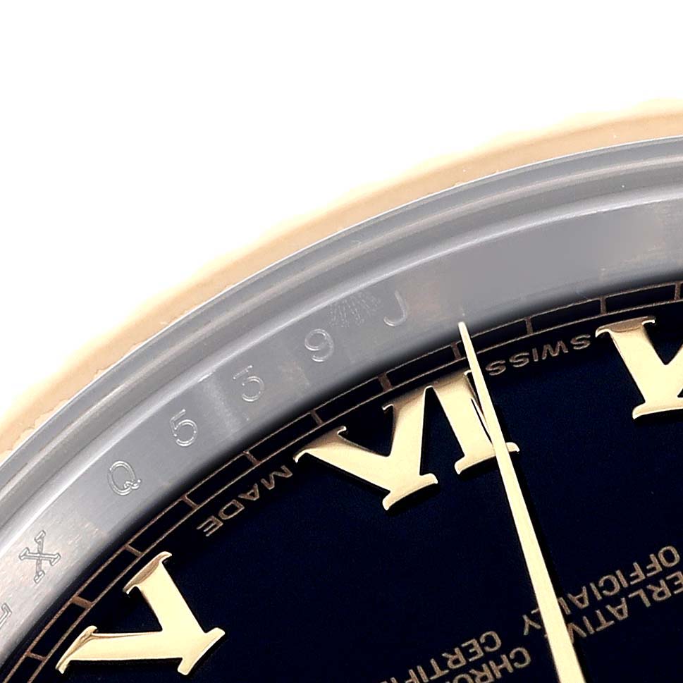 The image shows a close-up of the Rolex Datejust 41 116333 Men's Steel and Gold (two tone) Black Dial 116333 Men's Steel and Gold (two tone) Black Dial watch dial, including Roman numerals and part of the watch's rehaut.