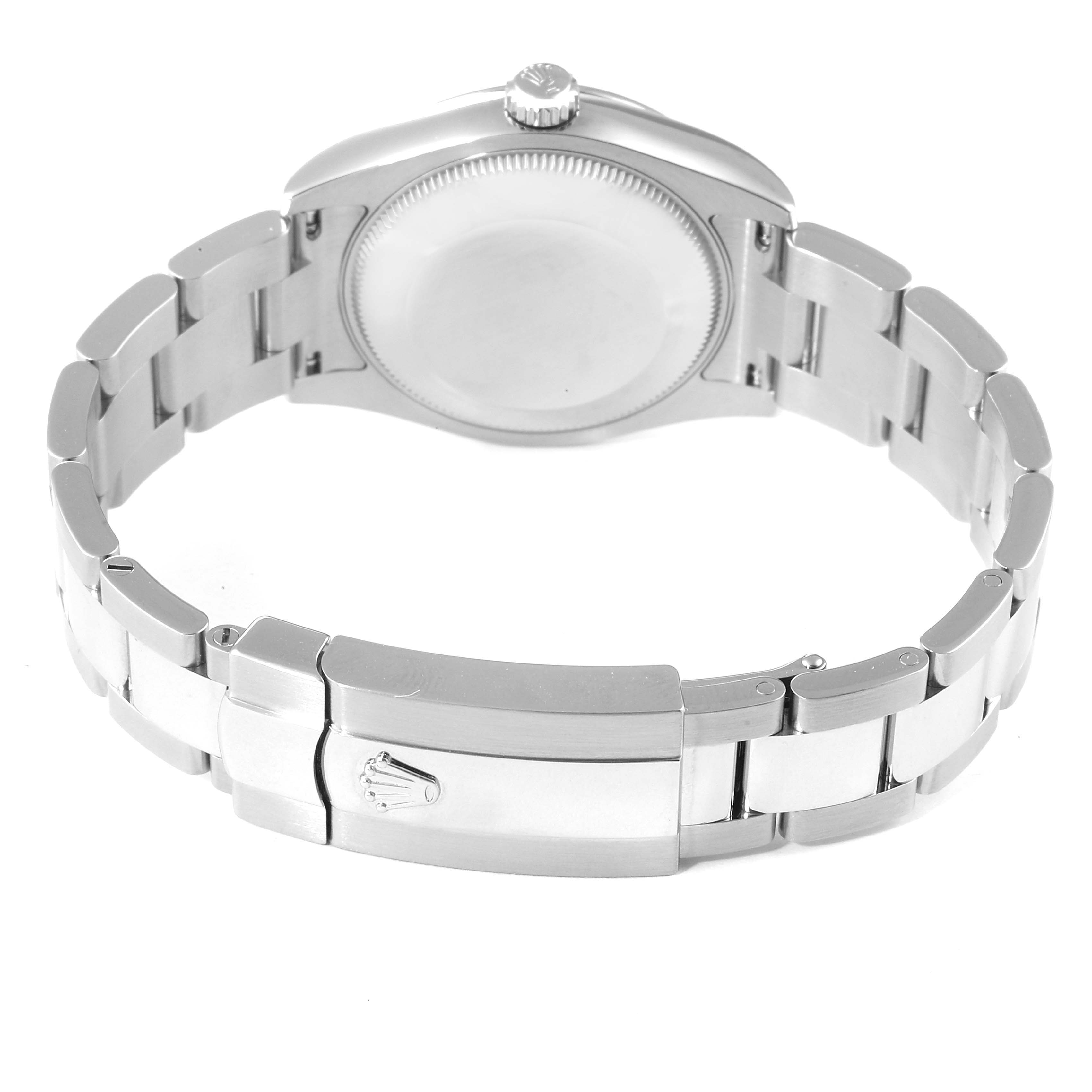 The image shows the back case, bracelet, and clasp of a mid-size Rolex watch from a rear angle.