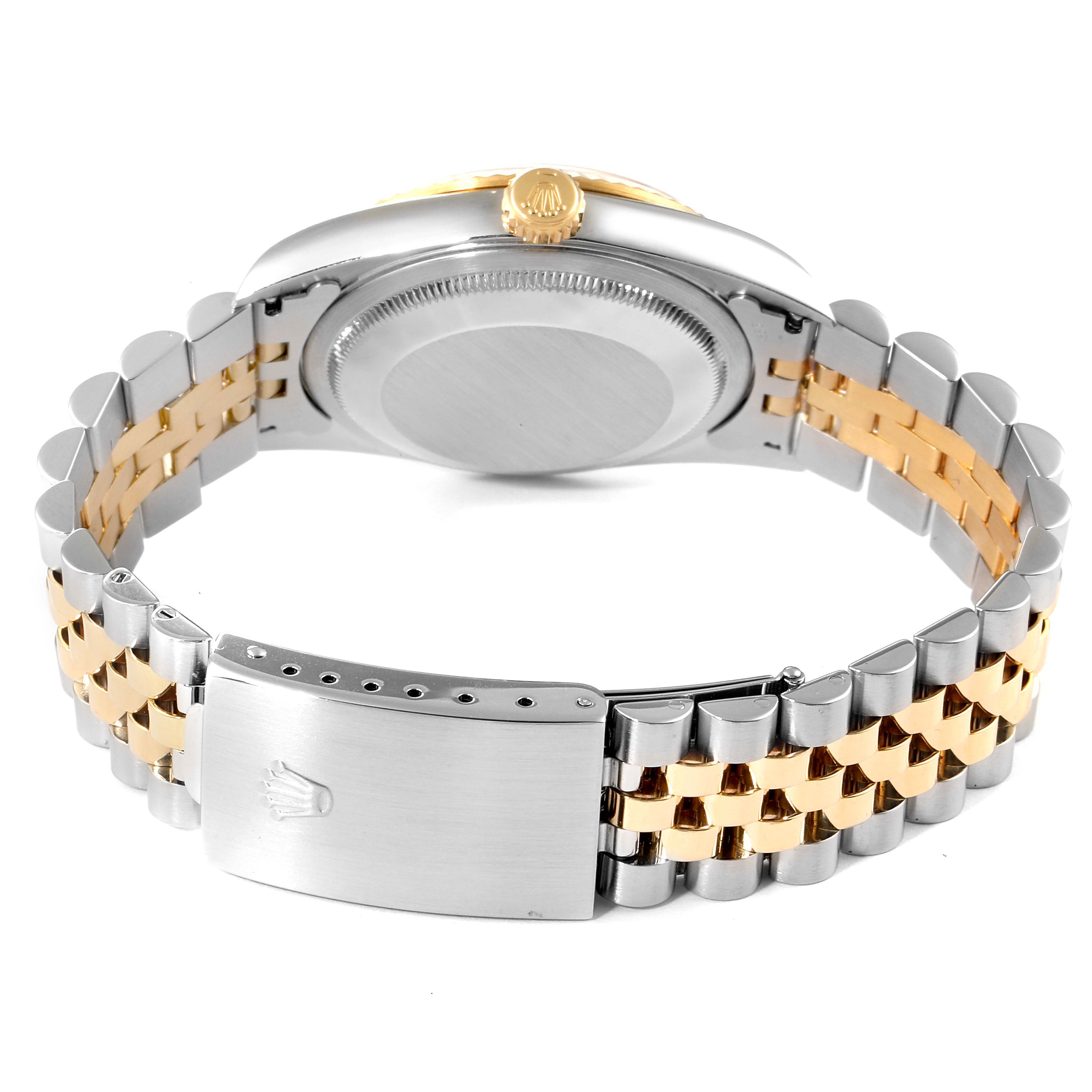 The image shows the rear view of a Rolex Datejust 16233 Men's Steel and Gold (two tone) White Dial 16233 Men's Steel and Gold (two tone) White Dial watch focusing on the caseback, crown, and Jubilee bracelet with a clasp.