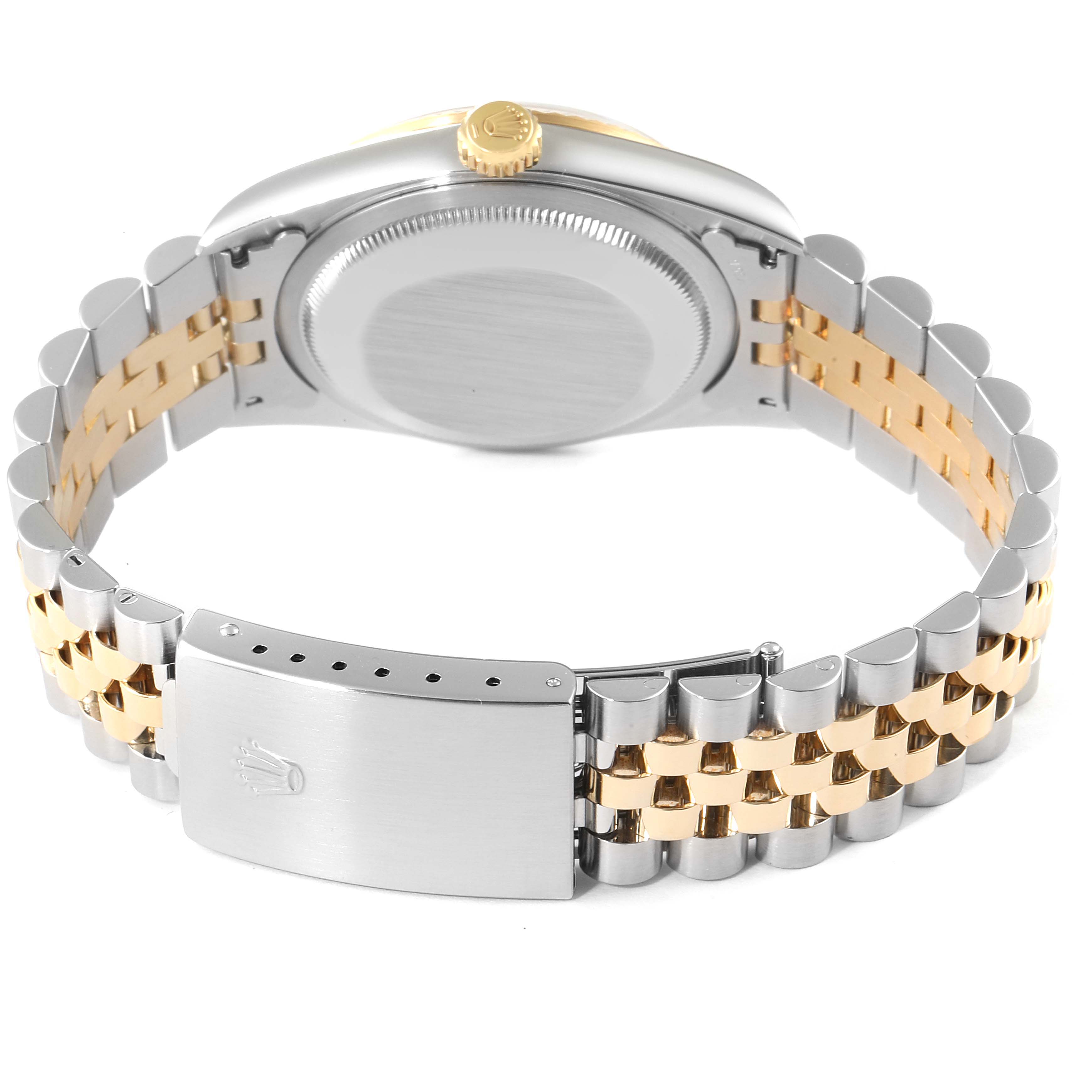 The image shows the back and clasp of a Rolex Datejust 16233 Men's Steel and Gold (two tone) White Dial 16233 Men's Steel and Gold (two tone) White Dial watch, highlighting its metal and gold bracelet.