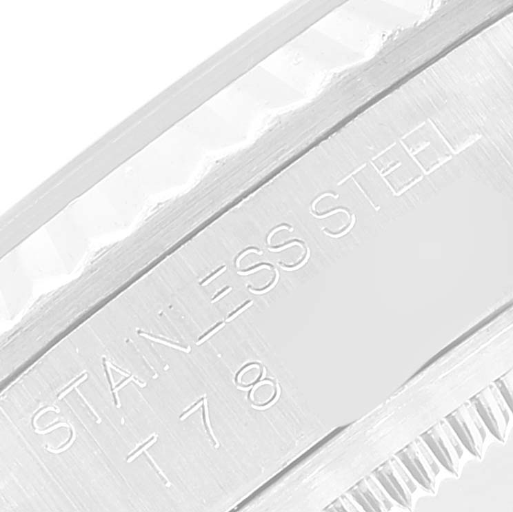 The image shows a close-up side view of the bezel and the "Stainless Steel" engraved on the Rolex Datejust 16234 Men's Stainless Steel Black Dial 16234 Men's Stainless Steel Black Dial watch.