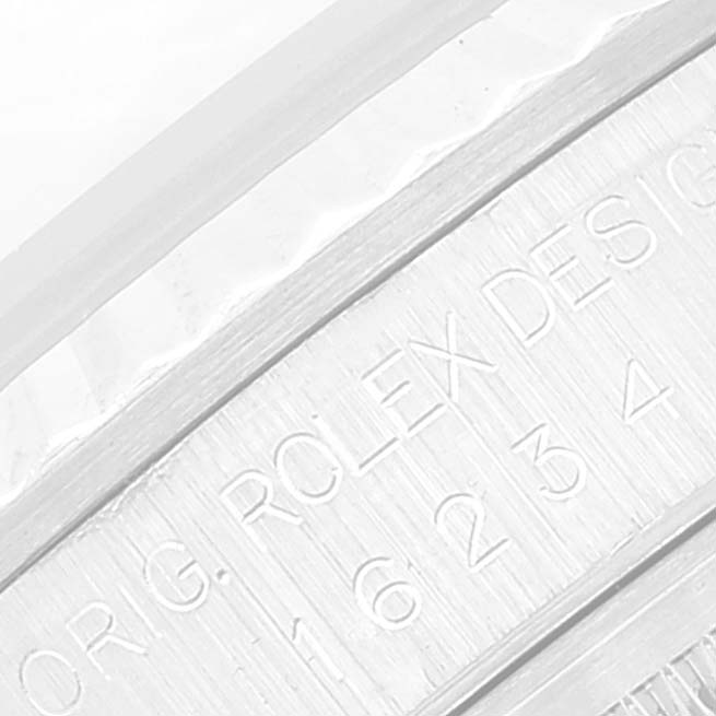 The image shows a close-up view of the engraving on the inner bezel of a Rolex Datejust 16234 Men's Stainless Steel Black Dial 16234 Men's Stainless Steel Black Dial watch.