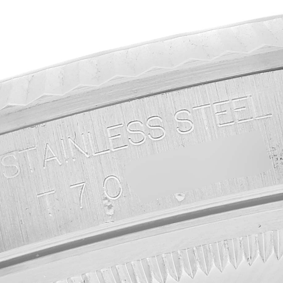 This is a close-up shot of the side engraving on a Rolex Datejust 16234 Men's Stainless Steel Silver Dial 16234 Men's Stainless Steel Silver Dial watch case, showing the "Stainless Steel" text.