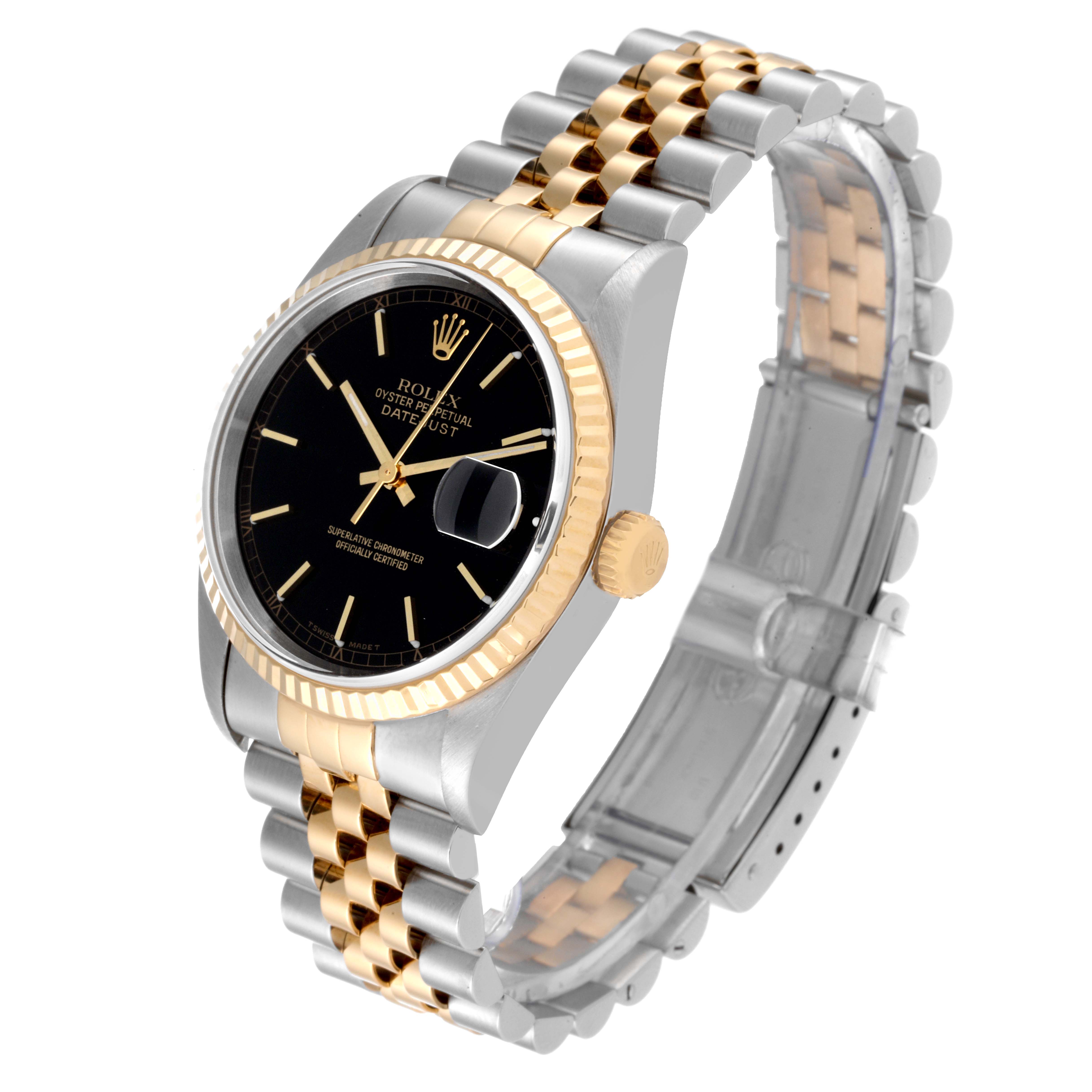 This image shows a Rolex Datejust 16233 Men's Steel and Gold (two tone) Black Dial 16233 Men's Steel and Gold (two tone) Black Dial watch at a slight angle, highlighting its black dial, gold bezel, and two-tone bracelet.