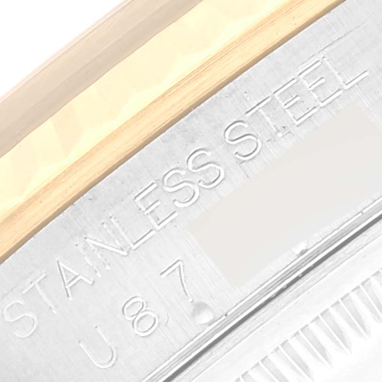 This image shows a close-up of the stainless steel case back of a Rolex Datejust 16233 Men's Steel and Gold (two tone) Black Dial 16233 Men's Steel and Gold (two tone) Black Dial watch.