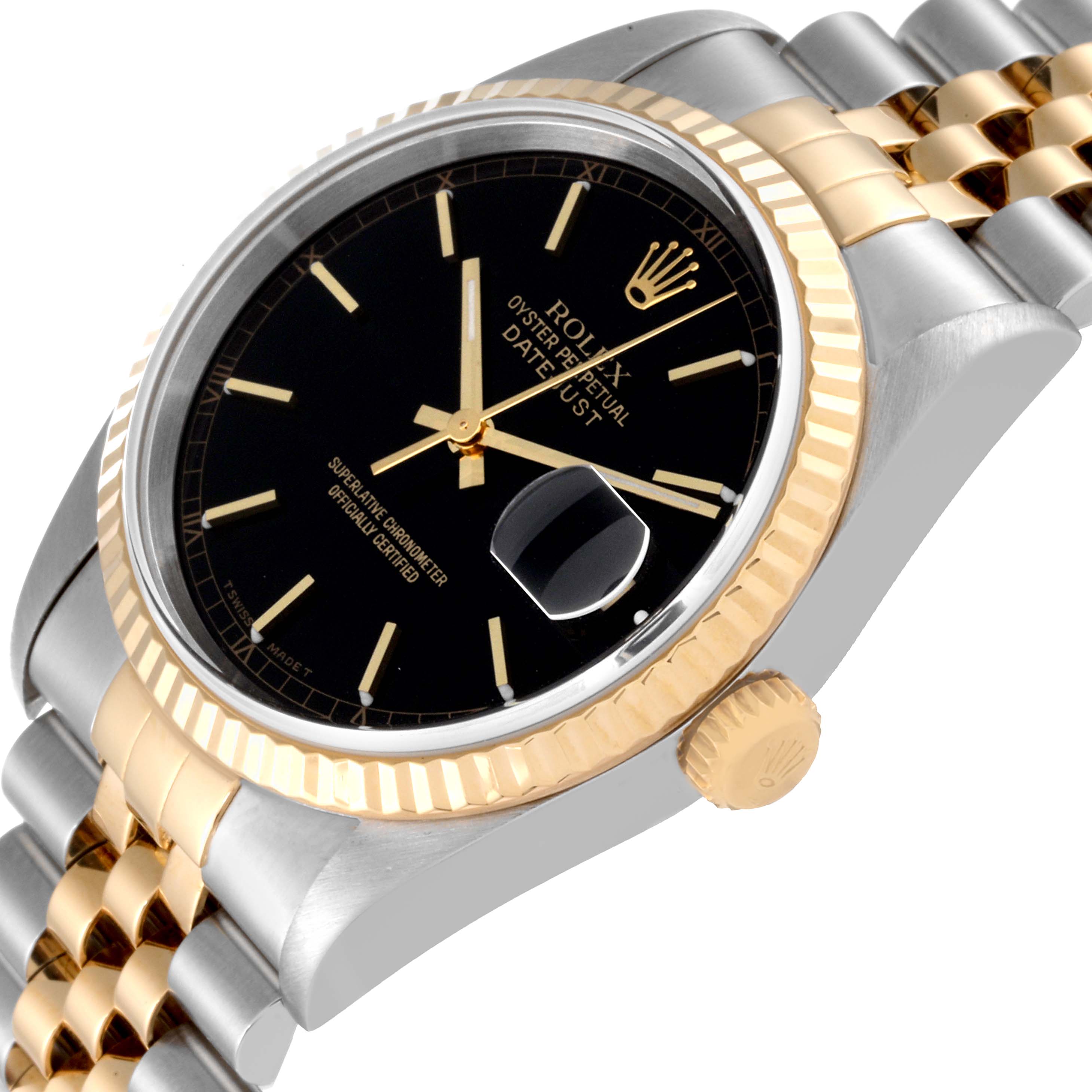This angled close-up shows the face, bezel, and part of the band of the Rolex Datejust 16233 Men's Steel and Gold (two tone) Black Dial 16233 Men's Steel and Gold (two tone) Black Dial watch.