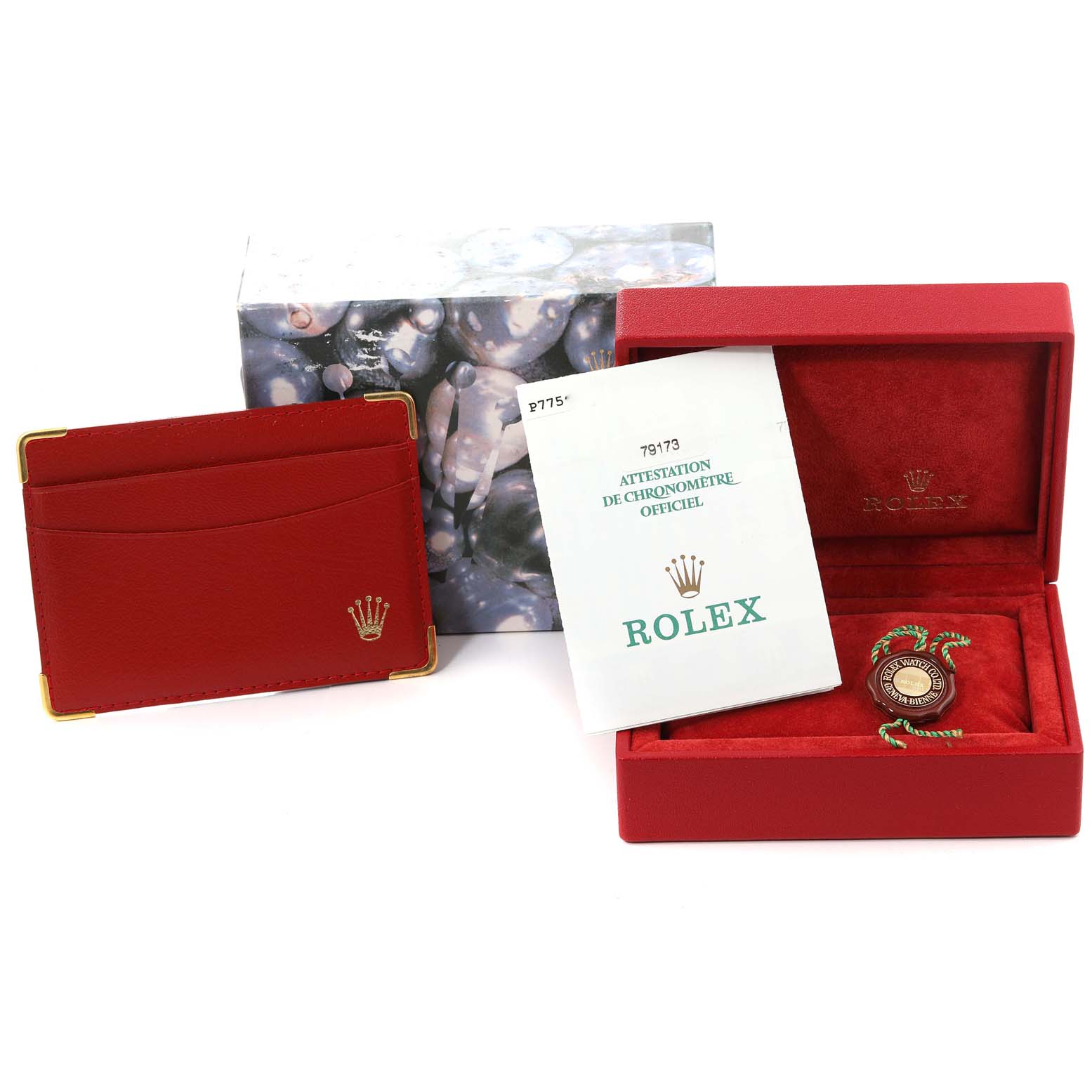 The image shows the packaging and accessories for a Rolex Datejust 79173 Women's Steel and Gold (two tone) Champagne Dial 79173 Women's Steel and Gold (two tone) Champagne Dial watch, including a red box, certificate, and cardholder.