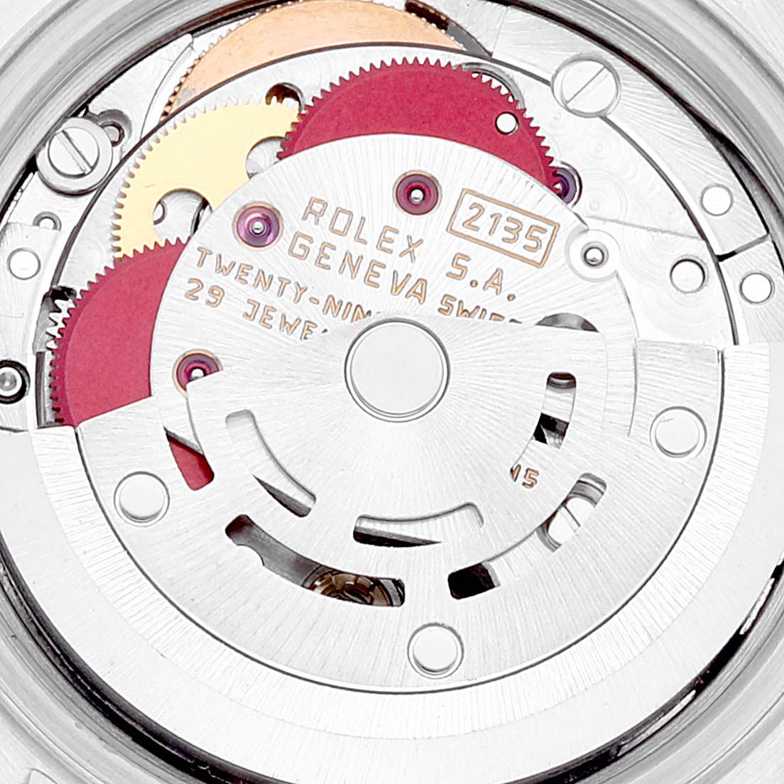 This is a close-up view of the Rolex Datejust 69173 Women's Steel and Gold (two tone) Black Dial 69173 Women's Steel and Gold (two tone) Black Dial's internal mechanism, showcasing its gears and engravings.