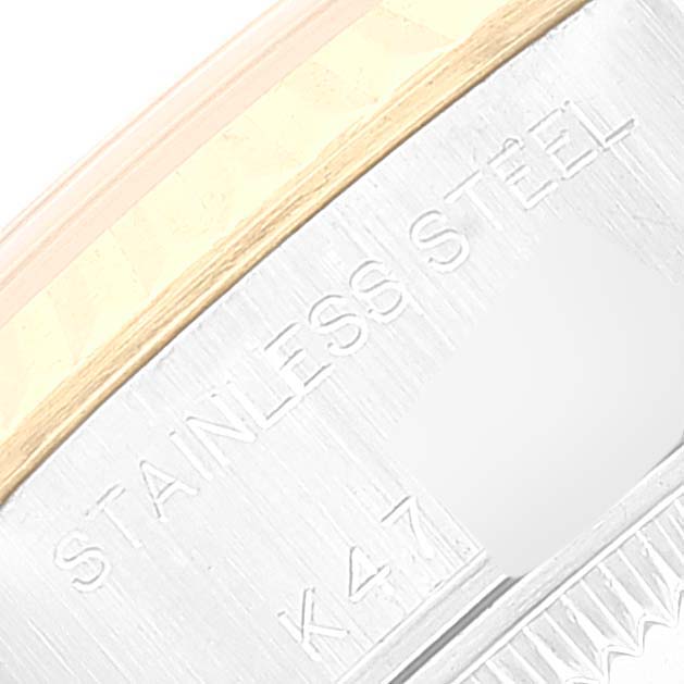 This image shows a close-up of the side of a Rolex Datejust 79173 Women's Steel and Gold (two tone) Champagne Dial 79173 Women's Steel and Gold (two tone) Champagne Dial watch, highlighting the "STAINLESS STEEL" engraving.