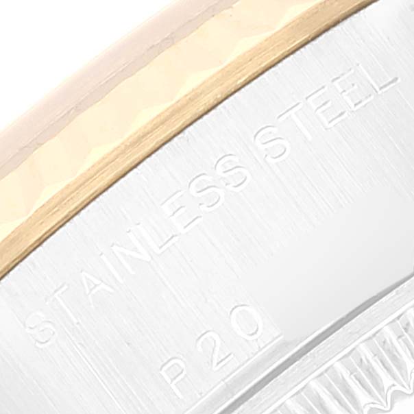 The image shows a close-up of the side of the bezel and part of the case of a Rolex Datejust 79173 Women's Steel and Gold (two tone) Mother of Pearl Dial 79173 Women's Steel and Gold (two tone) Mother of Pearl Dial watch, highlighting the "Stainless Steel" engraving.