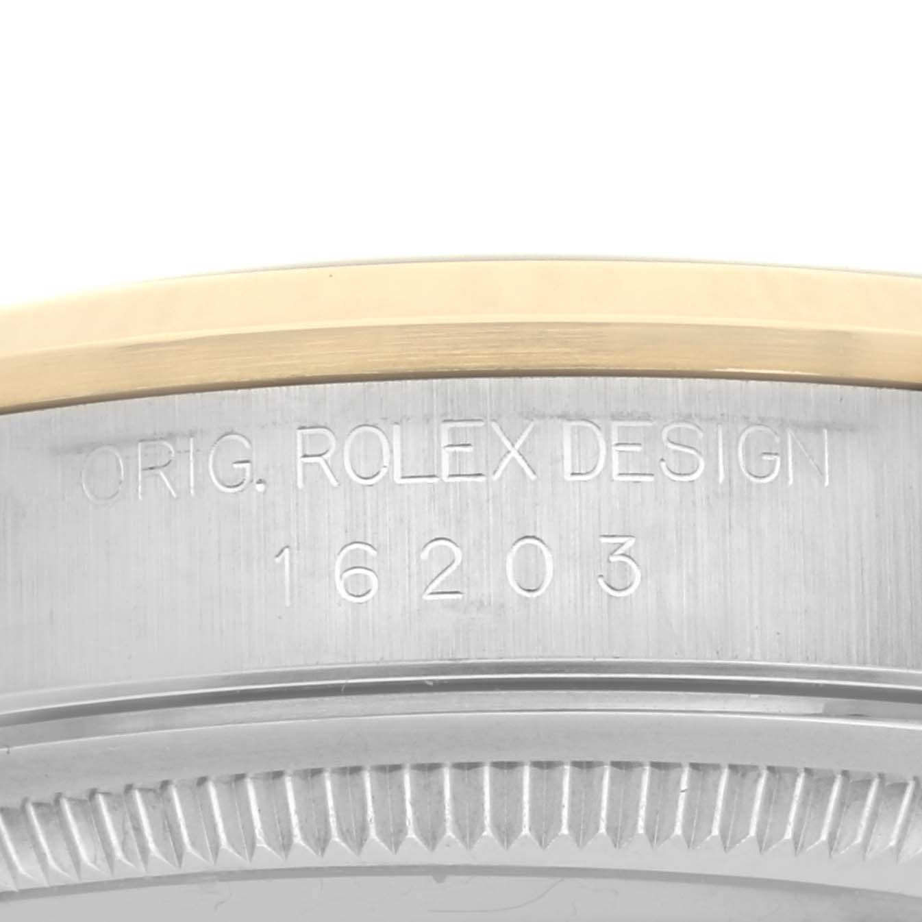 The image shows the side engraving on the bezel of a Rolex Datejust 16203 Men's Steel and Gold (two tone) Grey Dial 16203 Men's Steel and Gold (two tone) Grey Dial watch, displaying the model number.