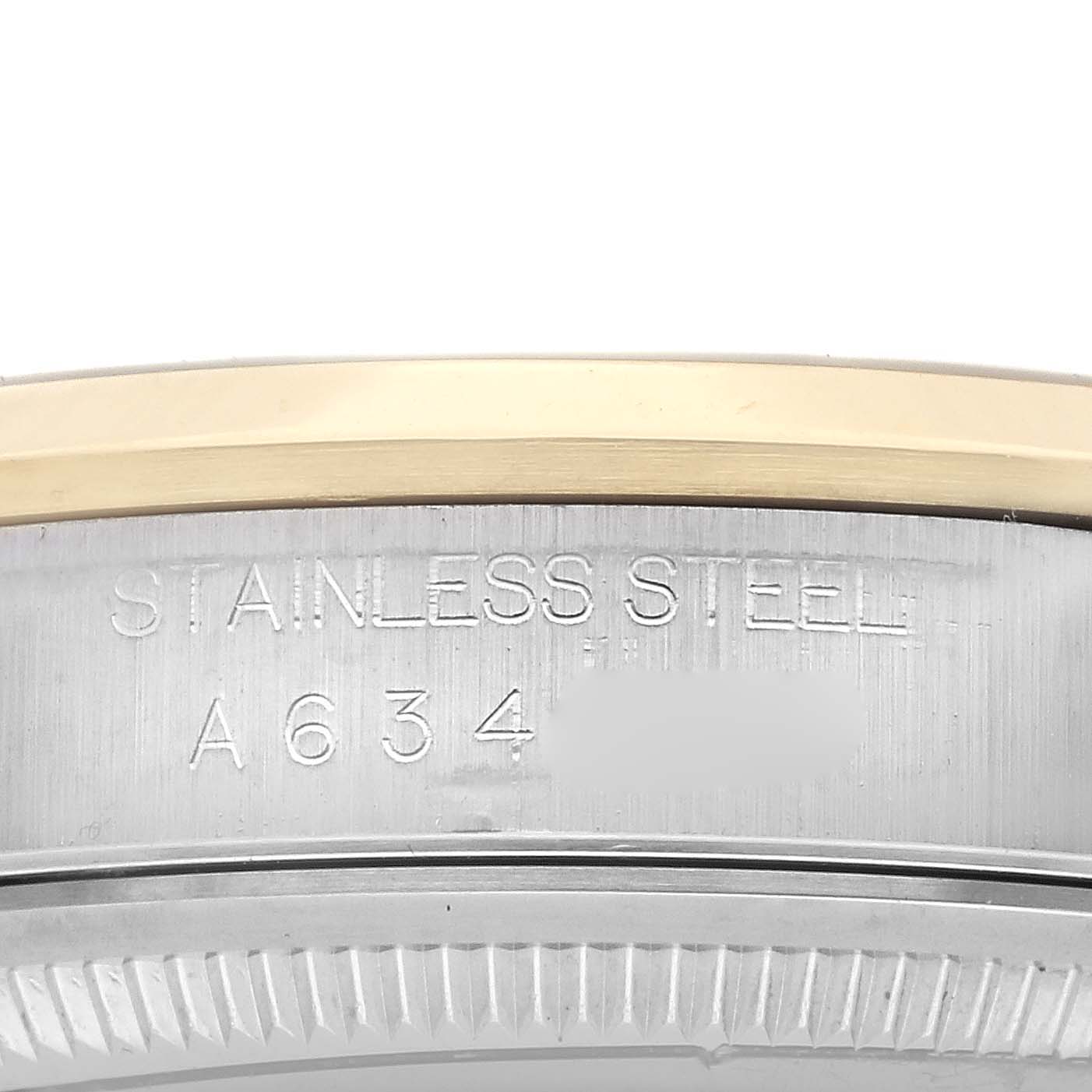 The image shows a close-up of the side of the Rolex Datejust 16203 Men's Steel and Gold (two tone) Grey Dial 16203 Men's Steel and Gold (two tone) Grey Dial's case, highlighting the "Stainless Steel" engraving.