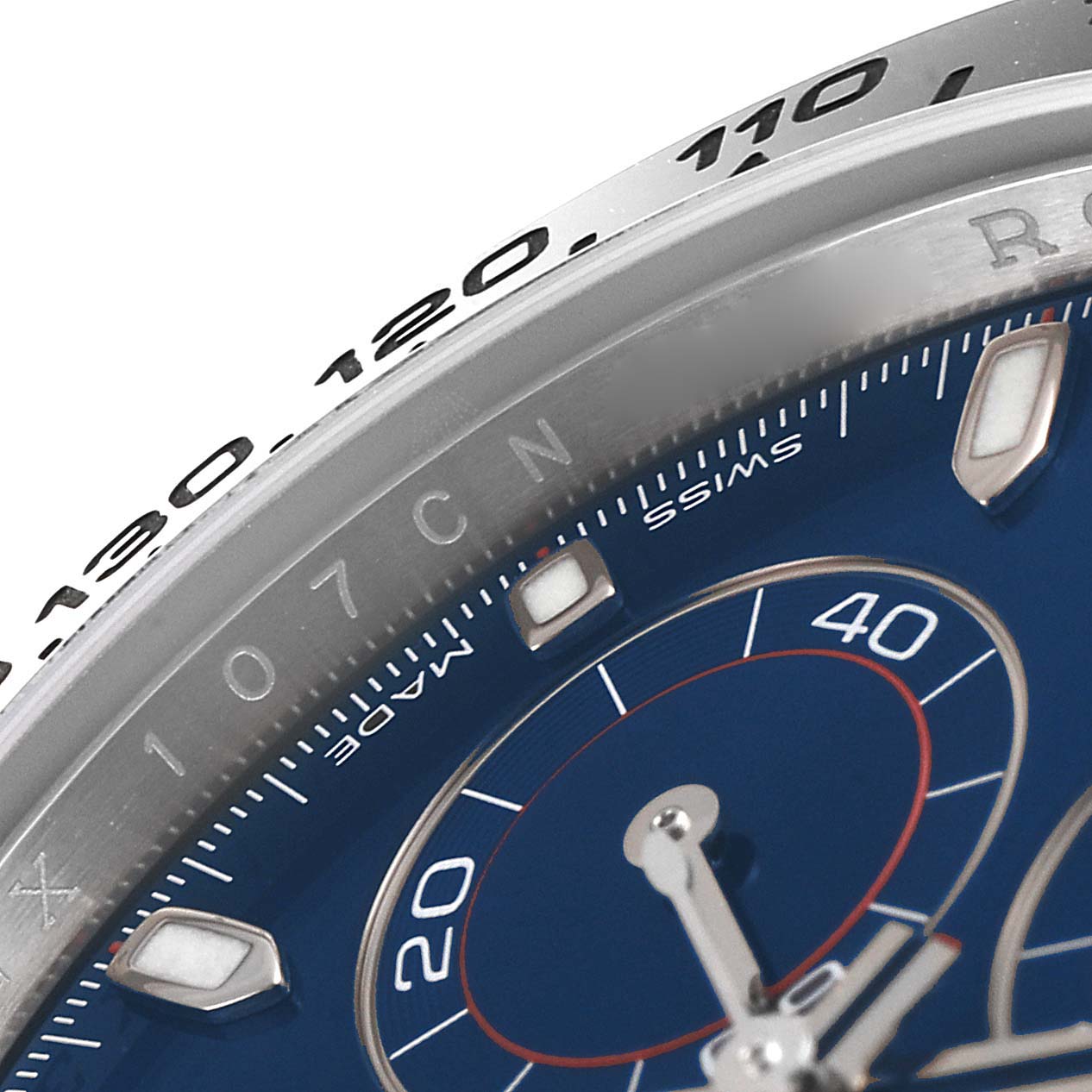 This close-up image shows the dial, indices, and part of the bezel of a Rolex Daytona 116509 Men's White Gold Blue Dial 116509 Men's White Gold Blue Dial watch.