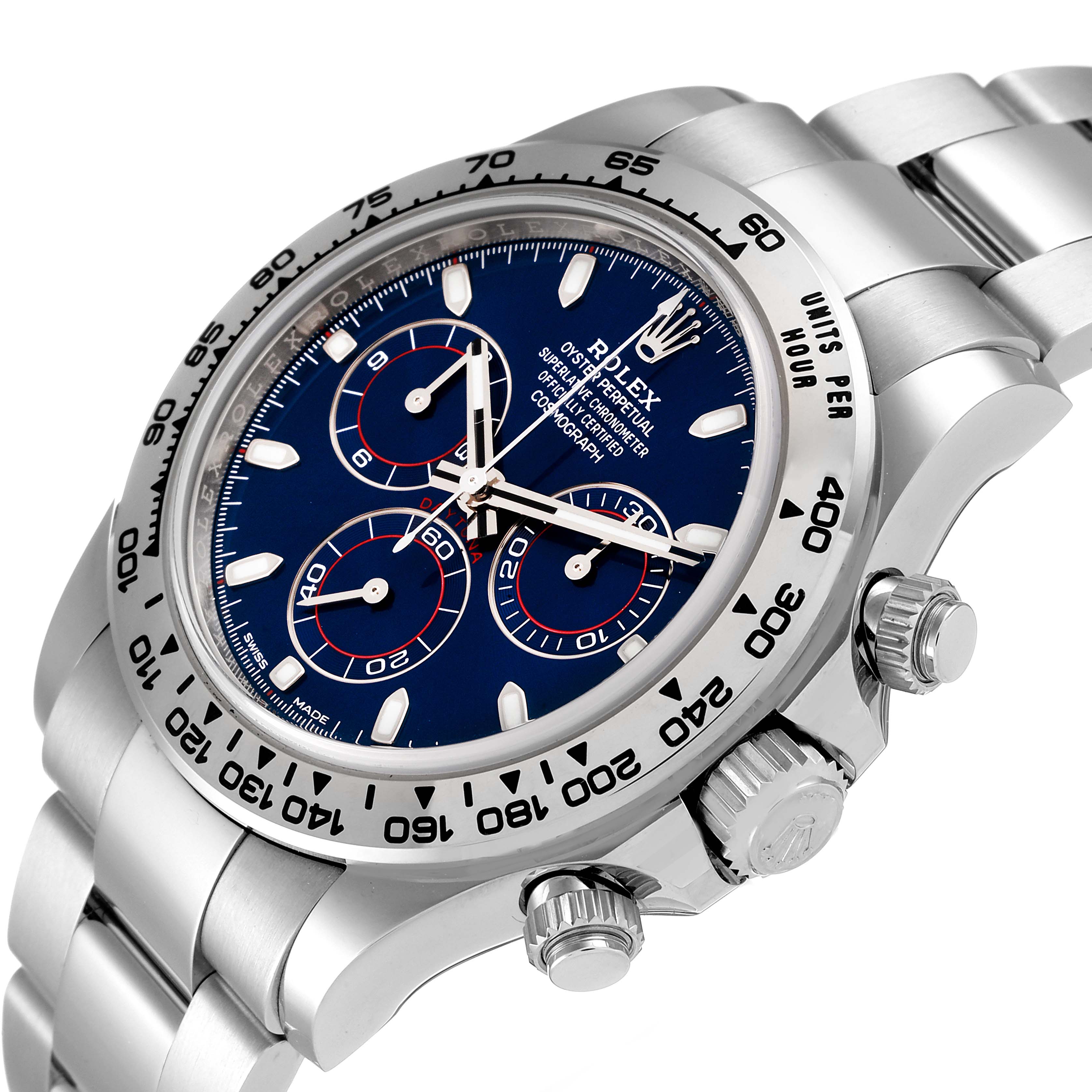 The image shows a close-up, angled view of a Rolex Daytona 116509 Men's White Gold Blue Dial 116509 Men's White Gold Blue Dial watch, highlighting the dial, bezel, crown, and pushers.