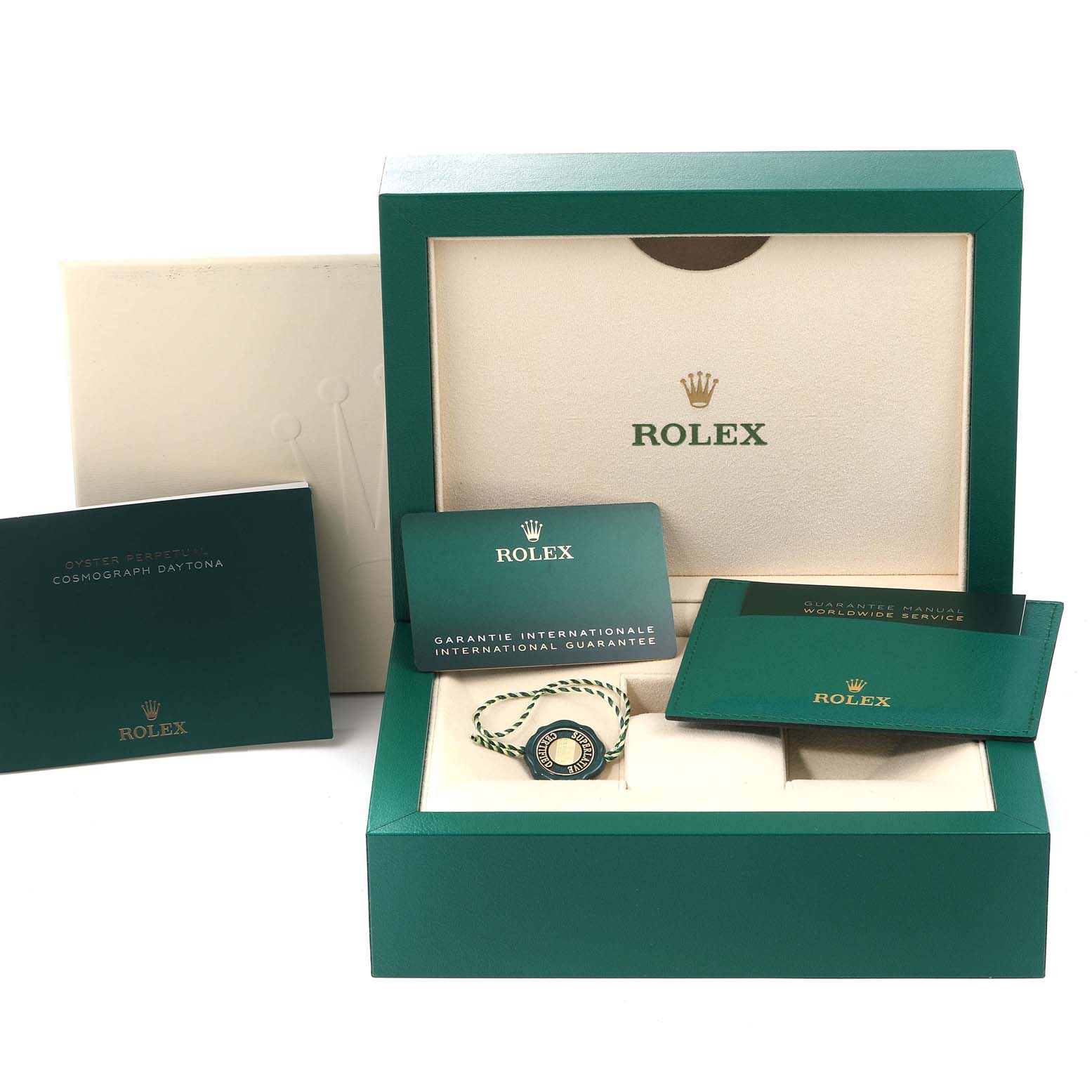 The image shows the packaging and accessories of a Rolex Daytona 116509 Men's White Gold Blue Dial 116509 Men's White Gold Blue Dial, including the box, guarantee card, booklet, and hangtag.