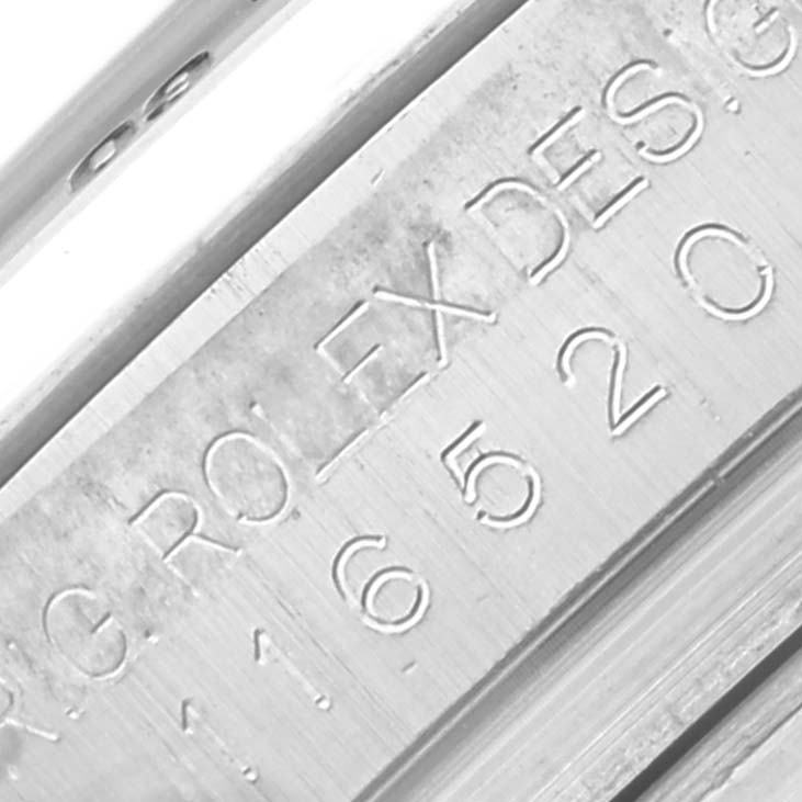 The image shows a close-up of the Rolex Daytona 116520 Men's Stainless Steel Black Dial 116520 Men's Stainless Steel Black Dial's engraved rim with the model information.