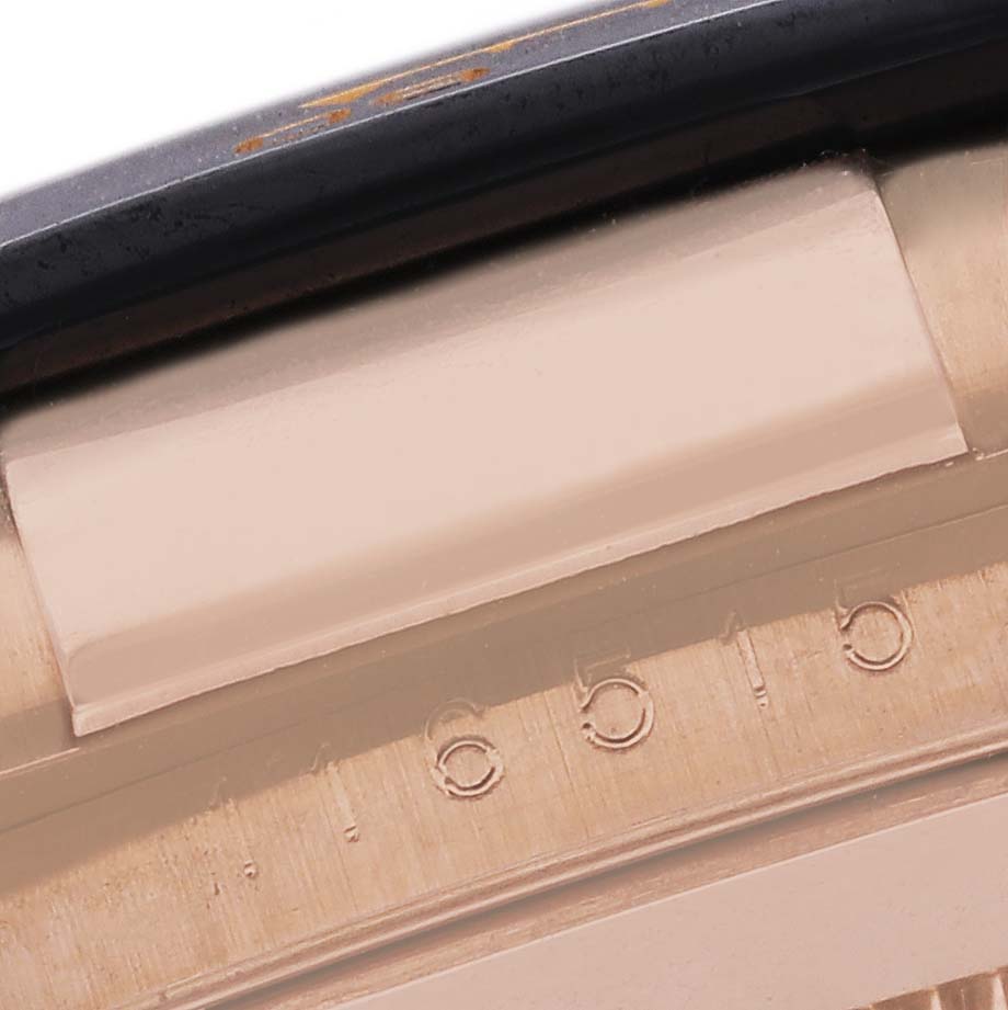 The image shows a close-up of the bezel and engraved details of a Rolex Daytona 116515 Men's Rose Gold Black Dial 116515 Men's Rose Gold Black Dial watch.