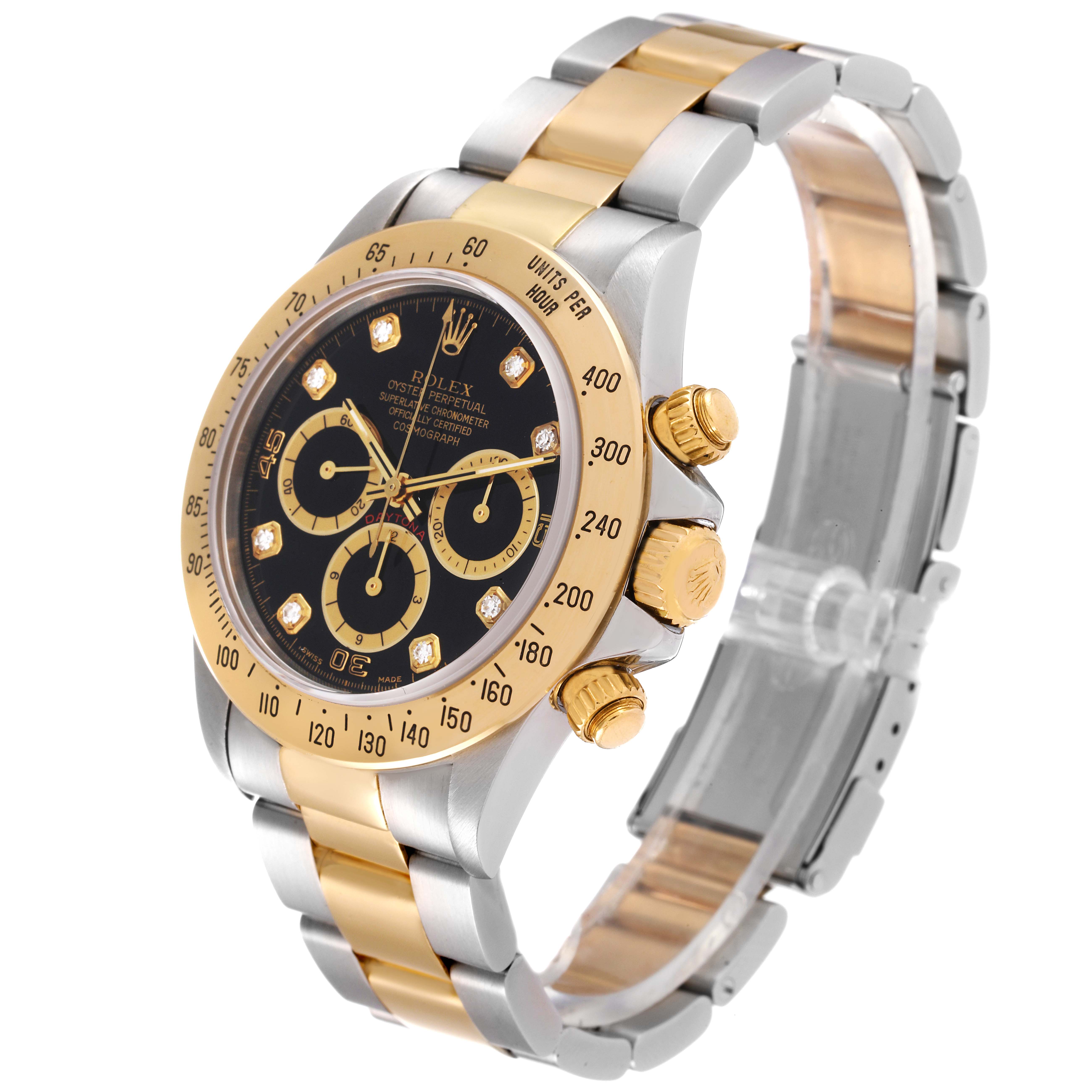 The image shows a Rolex Daytona 16523 Men's Steel and Gold (two tone) Black Dial 16523 Men's Steel and Gold (two tone) Black Dial watch at an angled view, highlighting the dial, bezel, and two-tone bracelet.