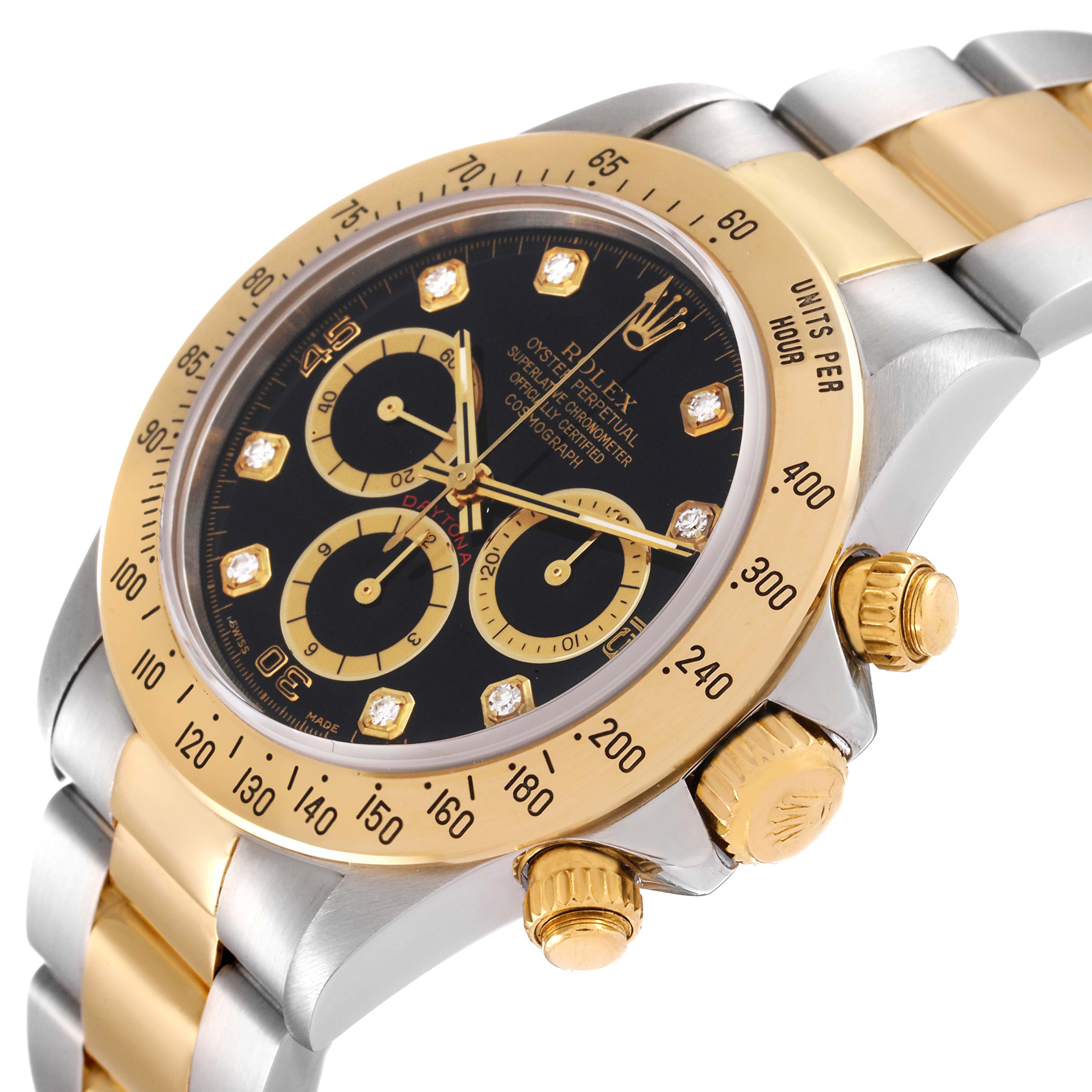 This image shows a close-up view of a Rolex Daytona 16523 Men's Steel and Gold (two tone) Black Dial 16523 Men's Steel and Gold (two tone) Black Dial watch face, bezel, chronograph dials, and part of the bracelet.