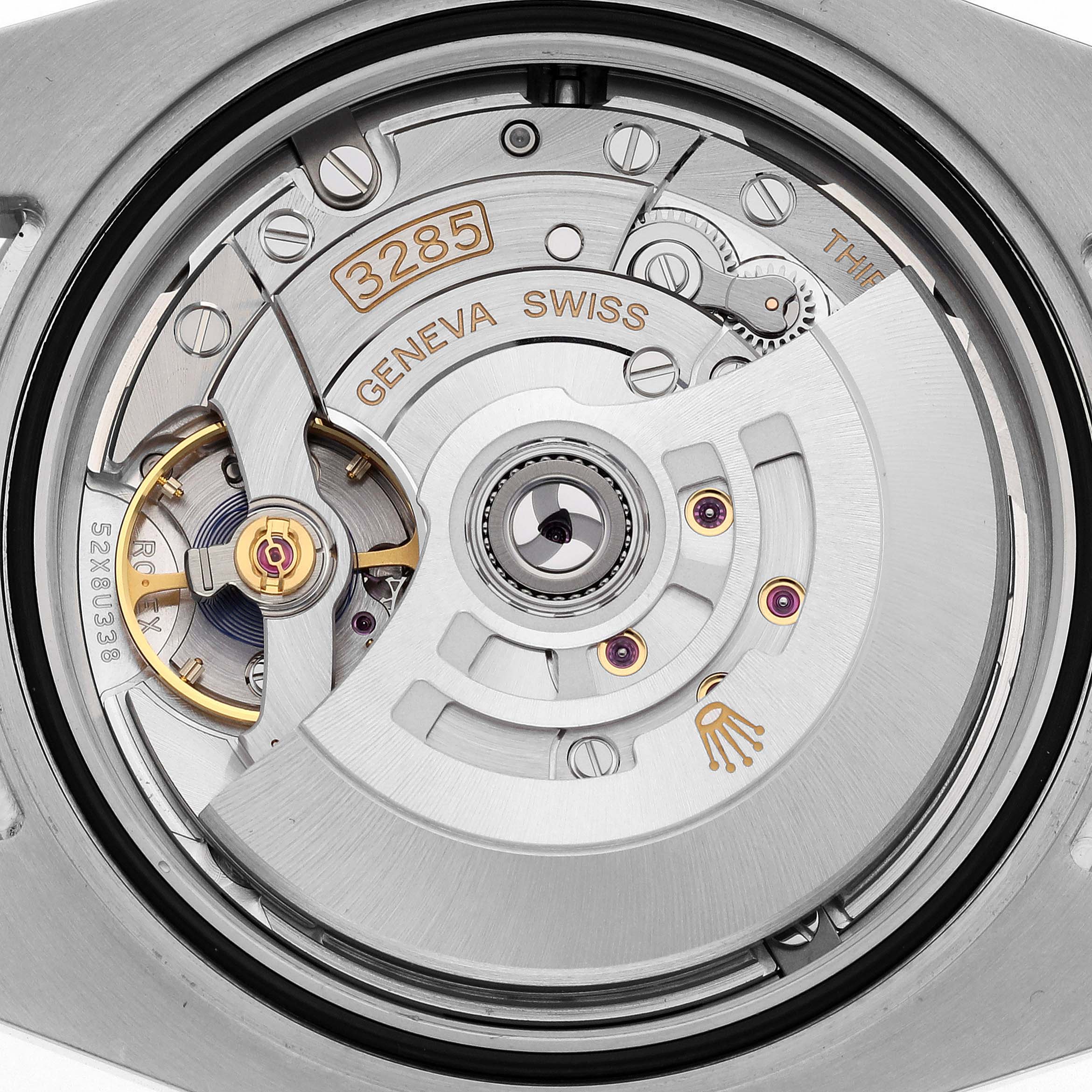 The image shows the movement of a Rolex GMT-Master 126710 Men
s Stainless Steel Black Dial 126710 Men
s Stainless Steel Black Dial, focusing on the intricate gears and rotor from the backside.