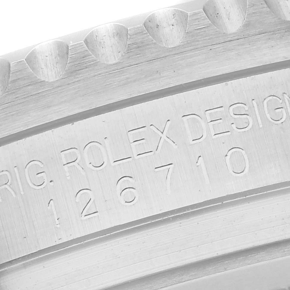 The image shows a close-up of the engraved bezel and case edge of a Rolex GMT-Master 126710 Men
s Stainless Steel Black Dial 126710 Men
s Stainless Steel Black Dial watch, focusing on the model number.
