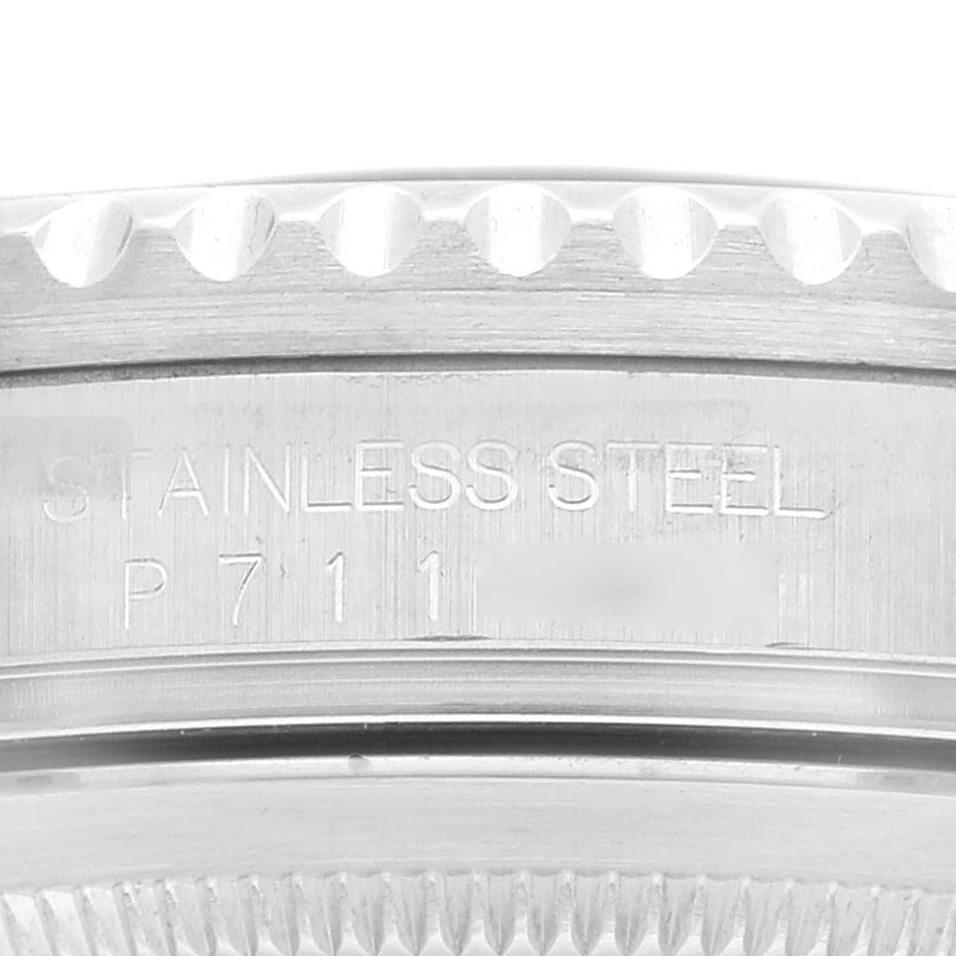 This is a close-up image of the case back showing the stainless steel material of a Rolex GMT-Master 16710 Men
s Stainless Steel Black Dial 16710 Men
s Stainless Steel Black Dial watch.