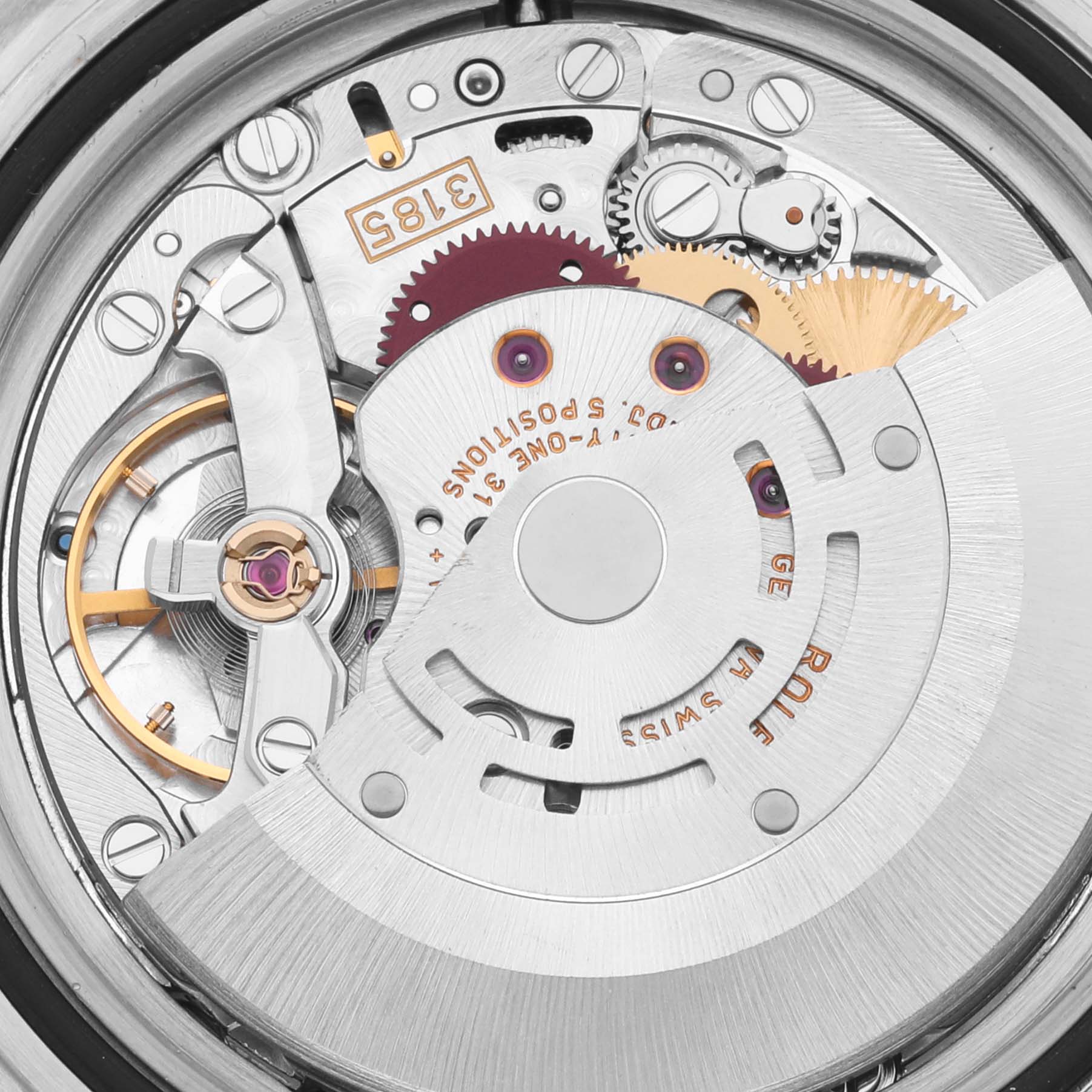 This image shows the movement and internal components of a Rolex GMT-Master 16713 Men's Steel and Gold (two tone) Brown Dial 16713 Men's Steel and Gold (two tone) Brown Dial watch from a close-up angle.