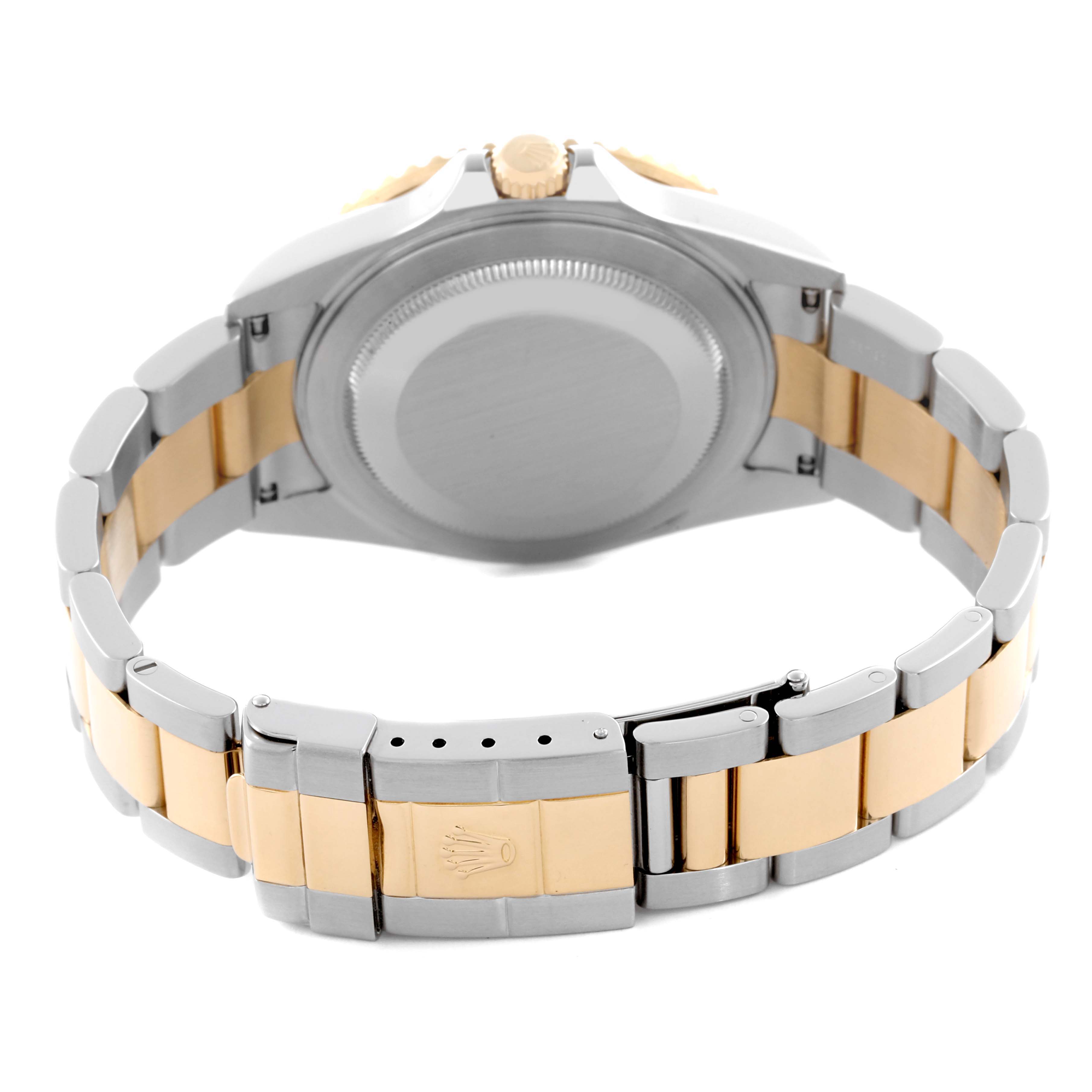 The image shows the back case and bracelet of a Rolex GMT-Master 16713 Men's Steel and Gold (two tone) Brown Dial 16713 Men's Steel and Gold (two tone) Brown Dial watch, displaying the two-tone metal band and clasp.