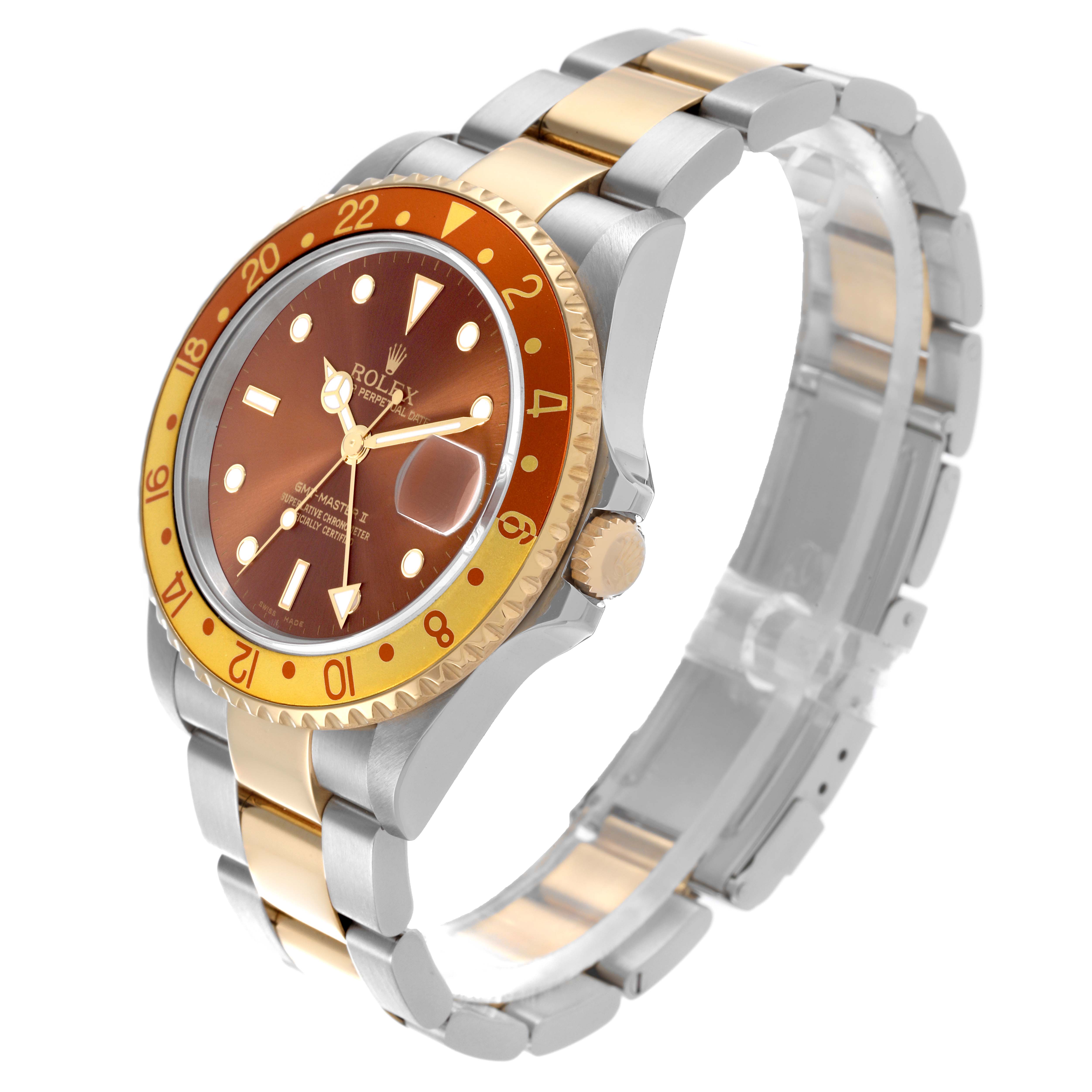 The Rolex GMT-Master 16713 Men's Steel and Gold (two tone) Brown Dial 16713 Men's Steel and Gold (two tone) Brown Dial watch is shown at a diagonal angle, highlighting the face, bezel, and two-tone bracelet.