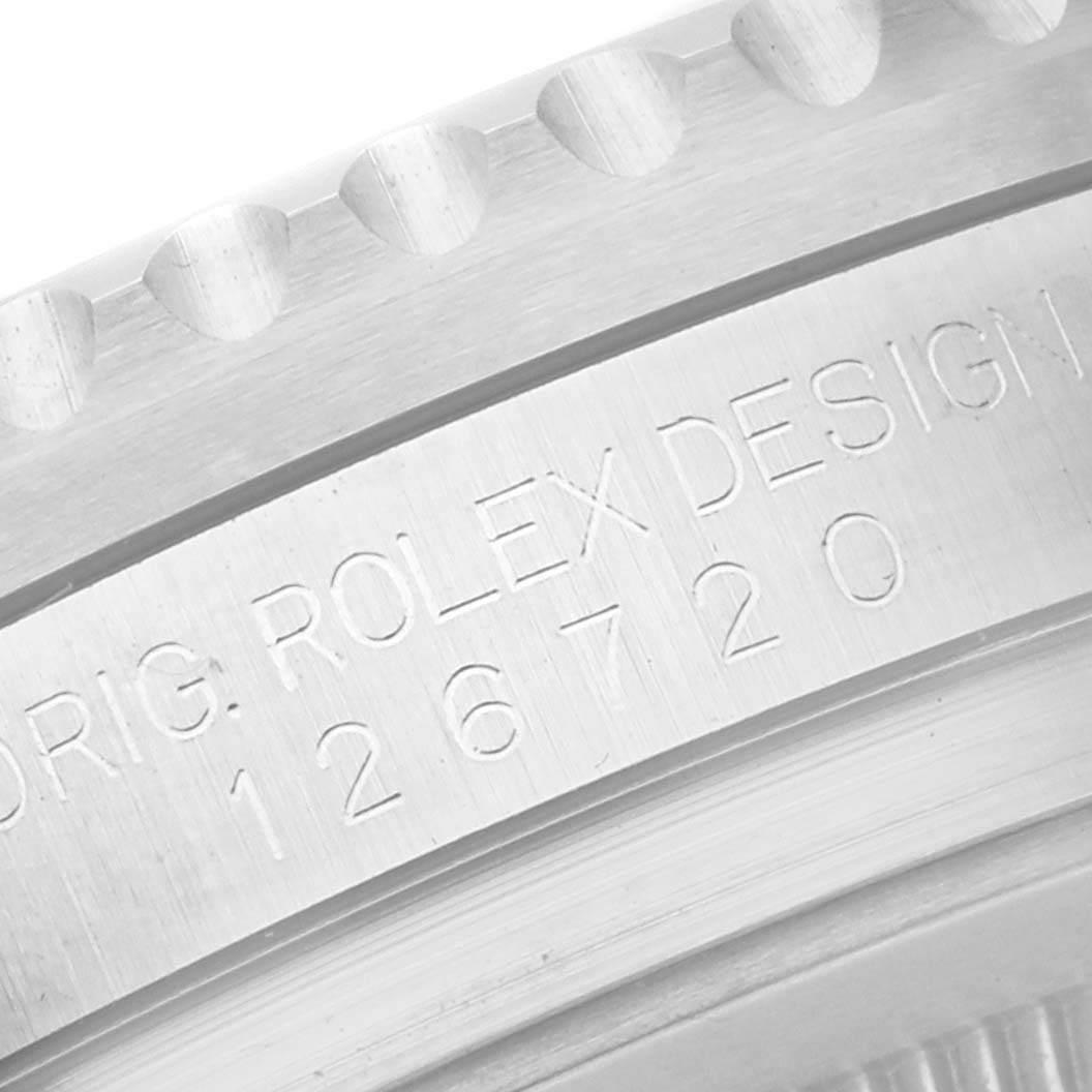 The image shows the side angle of a Rolex GMT-Master 126720VTNR Men's Stainless Steel Black Dial 126720VTNR Men's Stainless Steel Black Dial bezel with engraving details.