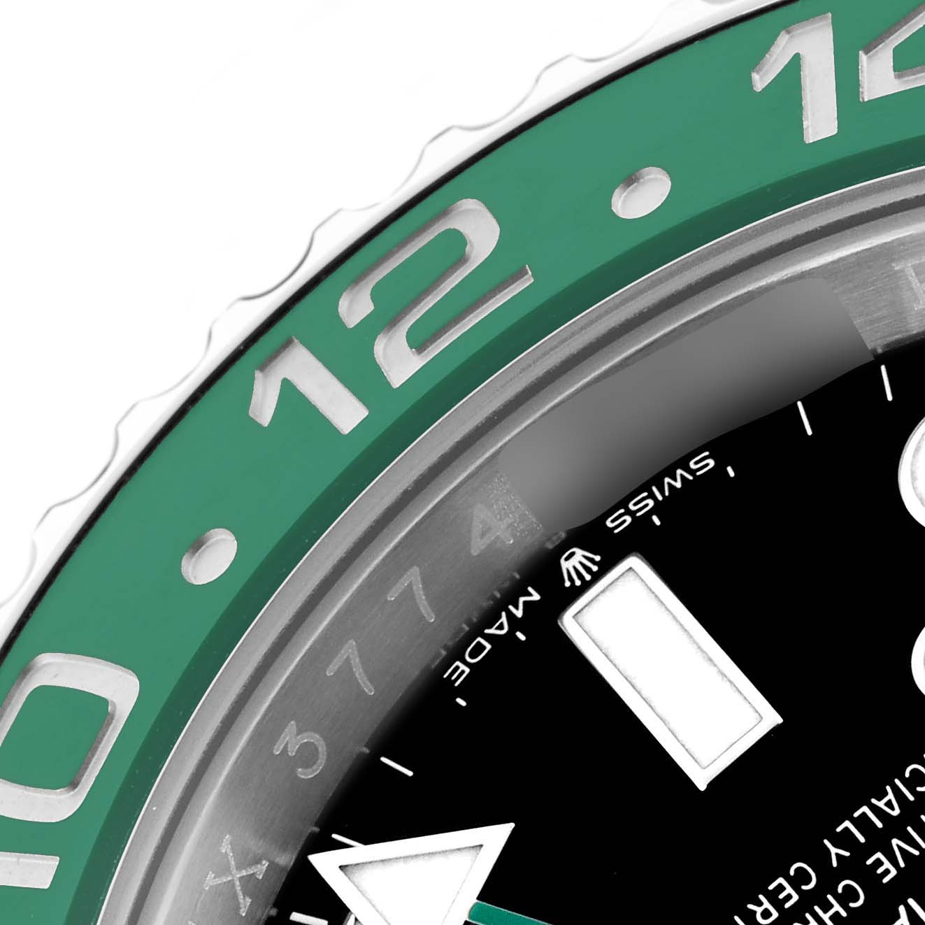 The image shows a close-up of the Rolex GMT-Master 126720VTNR Men's Stainless Steel Black Dial 126720VTNR Men's Stainless Steel Black Dial's green bezel and part of the black dial.