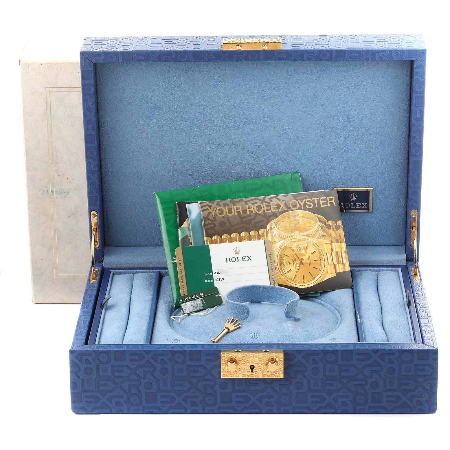 The Rolex Pearlmaster 80319 Women
s White Gold Mother of Pearl Dial 80319 Women
s White Gold Mother of Pearl Dial box is open, showing documents, a tag, and watch slots with a central pad.