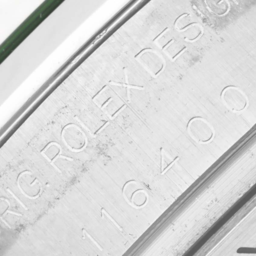 This close-up image shows the engraved inner bezel of a Rolex Milgauss 116400 Men's Stainless Steel Black Dial 116400 Men's Stainless Steel Black Dial watch with model details.
