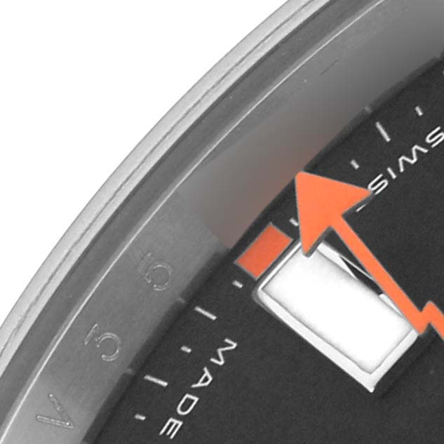 The image shows a close-up of the Rolex Milgauss 116400 Men's Stainless Steel Black Dial 116400 Men's Stainless Steel Black Dial watch dial, focusing on an orange seconds hand and part of the bezel.