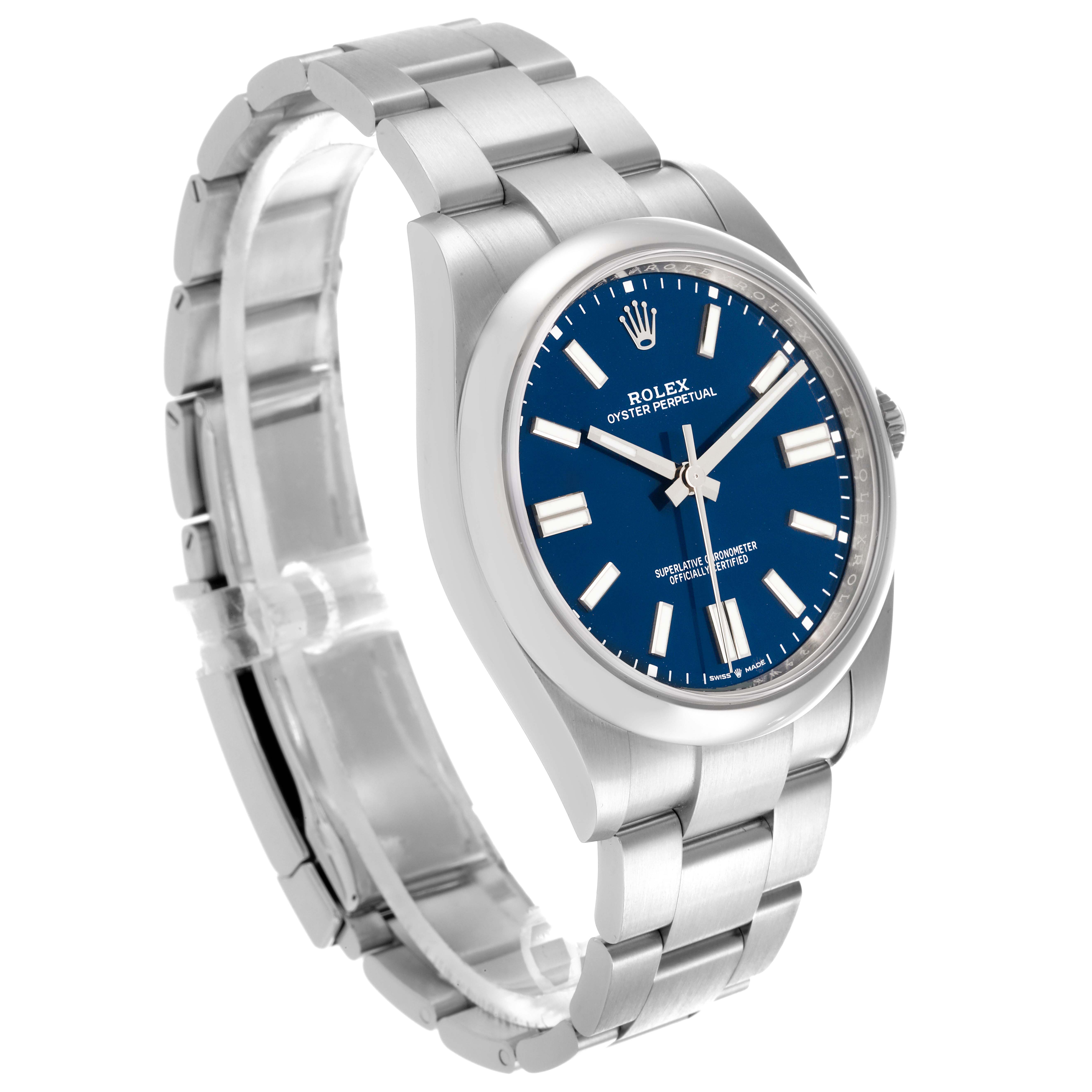 The Rolex Oyster Perpetual 124300 Men's Stainless Steel Blue Dial 124300 Men's Stainless Steel Blue Dial watch is shown at a three-quarter angle, displaying the blue dial, bezel, and bracelet.