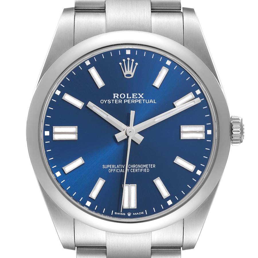 The Rolex Oyster Perpetual watch is shown from the front, displaying the blue dial, hands, markers, and crown.